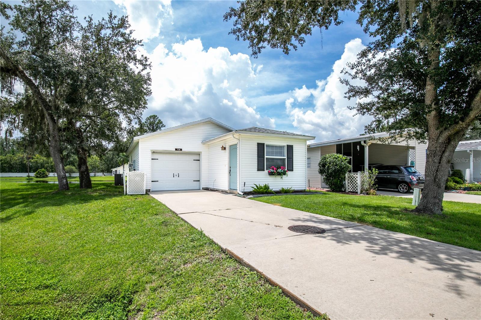 Welcome to Pennbrooke Fairways, a 55 plus community in the heart of Central Florida. This is a very active community with so many amenities and clubs to keep you busy. Three golf courses, pro shop, pickleball, restaurant, two swimming pools, two club houses, and a club or group for just about every interest. If that's not enough, The Villages is less than 2 miles down the road where you will find shopping, dining, entertainment, and medical services. A favorite benefit among Pennbrooke residents is the low HOA fee of $255 which includes your lawn care, expanded cable services, and internet. One of the best priced single-family homes now available here, this is a nice light and bright home that has been tastefully updated. This would make a GREAT SEASONAL HOME to escape the cold winters up north. It is partially furnished and what you see will stay with the house when sold. With a cottage vibe, this one bedroom one bath easy to maintain house overlooks a pond at the end of a street. You'll enjoy a little bit more elbow room here with no neighbor on one side. The bedroom has a walk in closet and a laundry room. The kitchen opens to the living space and has a bar top for informal meals. There is a one car garage with window air in place so you can turn this into an office, workshop, or hobby room. Roof was done in 2021 and HVAC replaced in 2016. This is a perfect home if you are looking for something that's easy to maintain so more time can be spent enjoying the good life here in Pennbrooke. We are just an hour to Disney or Orlando International Airport, and very close to toll roads and I-75 to take you with ease to other areas to explore. Come and see this one today!