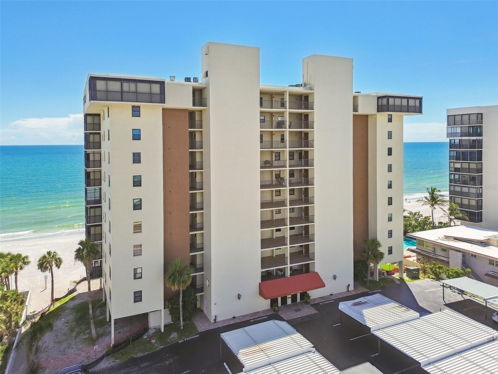 If you are looking for a condo that is in move in condition, this is the one for you! Experience stunning Gulf Front living in this beautifully updated two bedroom, two bath Madeira Beach condo. Interior features include luxurious bamboo flooring, an open concept layout and plenty of natural light. This beautifully maintained condo offers breathtaking Gulf views from nearly every room. The remodeled kitchen boasts granite countertops, stainless steel appliances and in unit laundry for added convenience. Both bathrooms have been thoughtfully updated for functionality and style. A spacious primary suite with a large custom designed walk-in closet and private bath provides comfort and privacy. Enjoy your morning coffee or evening sunsets on the private lanai overlooking the Gulf and pristine shoreline of Madeira Beach. Recent improvements within the last two years include a new HVAC and water heater. With its own carport, plenty of guest parking and just minutes from restaurants, shopping and fun entertainment, this place is Florida living at its best! Come and see this meticulously maintained condo today and make it yours tomorrow!