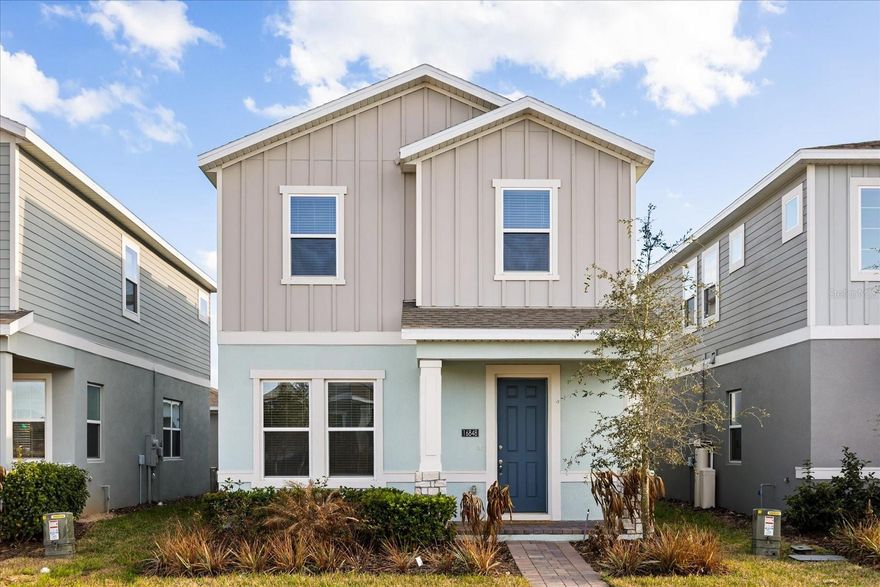 Discover the timeless appeal of the Newbury floor plan in the exclusive Hamlin Pointe community! This 2024-built two-story home offers 4 bedrooms, 3 full bathrooms, and 2,088 sq ft of thoughtfully designed living space. A versatile first-floor bedroom serves perfectly as a guest suite, home office, or multi-generational retreat. The open-concept great room and dining area are anchored by a gourmet kitchen featuring quartz countertops, upgraded cabinetry, stylish backsplash, and a built-in cooktop, oven, and microwave — ideal for both casual family meals and effortless entertaining. Upstairs, three additional bedrooms surround a spacious owner’s suite with a generous walk-in closet, plus a conveniently located laundry room. Outside, enjoy a covered patio for relaxing or dining al fresco, and the privacy of a detached two-car garage on a low-maintenance lot. Nestled in the heart of Hamlin within Horizon West — one of Orlando’s fastest-growing areas — Hamlin Pointe delivers walkable resort-style living at its best. Stroll or bike to the vibrant Hamlin Town Center along scenic Lake Hancock for dining, shopping, entertainment, and year-round events. Families love the top-rated schools, abundant parks, trails, and new medical facilities. Just minutes to Walt Disney World, downtown Winter Garden, Winter Garden Village, SR 429, and Florida’s Turnpike, this boutique community of only 53 homes offers the perfect blend of modern convenience, low-maintenance luxury, and long-term investment value in a location where others vacation every day.