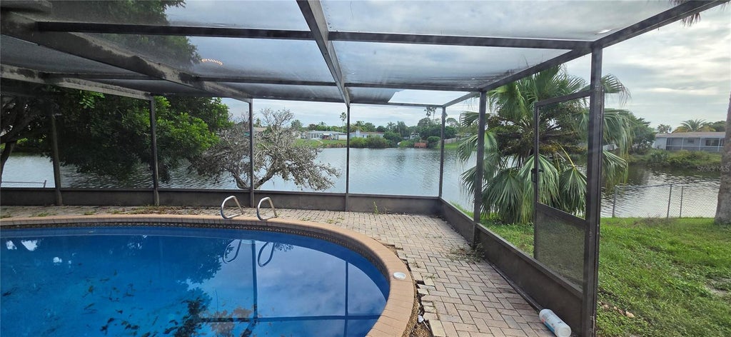 Photo of 9348 Lake Christina Lane, Port Richey, FL 34668 (MLS # W7890583)