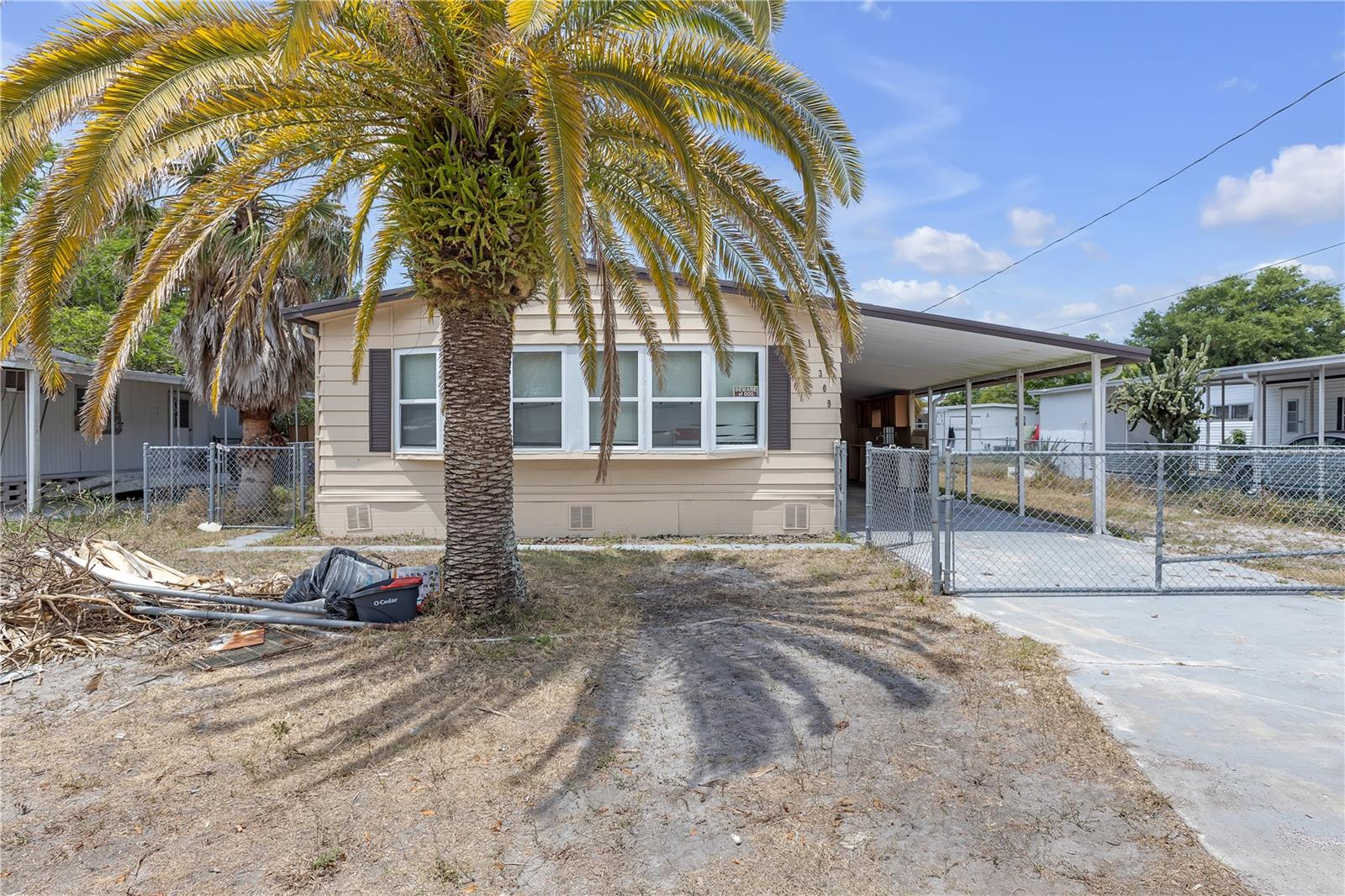 This updated 2-bedroom, 2-bath doublewide mobile home sits on its own lot—no HOA, no lot rent, and no flood zone! Located in a quiet, peaceful neighborhood, this home offers freedom and flexibility without the extra fees.
Step inside an open floor plan with an open kitchen and 2 spacious bedrooms both with walk-in closets. The yard is completely fenced in great for pets, family fun, or just relaxing outdoors. The property includes a detached shed with a dedicated laundry room and an outdoor kitchen perfect for weekend cookouts!
A new septic tank was installed this year. This property would makes a great rental property for an investor.
Conveniently close to local shops, dining, and major highways, this home offers a rare opportunity at a great value, and location.