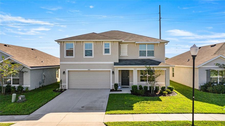 Welcome home to generously sized 2 story Hayden model with a front porch. Recently built in 2022 and conveniently located in the gated community of Greystone Hills. Features 5 bedrooms, 3 full baths, 2 car garage plus a Flex room downstairs and a bonus loft / living room upstairs, 2,661 living sq ft. Open concept downstairs with a large kitchen overlooking the living and dining room, flex room is an ideal office or study to work from home and 1 bedroom and full bath on this main level and covered back patio. The primary suite and spa like bath is upstairs with three other guest rooms all similarly sized, full guest bath, the bonus loft / upstairs living room and the laundry room is upstairs for convenience. There is plenty of storage is this home as well.  Extras include: Termite bond, Seco Surge protector, gutters, tiled floor in additional areas, ceiling fans, glass shower doors added in both full baths upstairs, knobs and handles added to all cabinets in kitchens and baths. Zoned for Hammet Bowen Elementary, Liberty Middle and West Port High School. Greystone Hills is a lovely gated community in South West Ocala. Enjoy the Olympic sized community pool. Take a look at everything this lovely property has to offer!