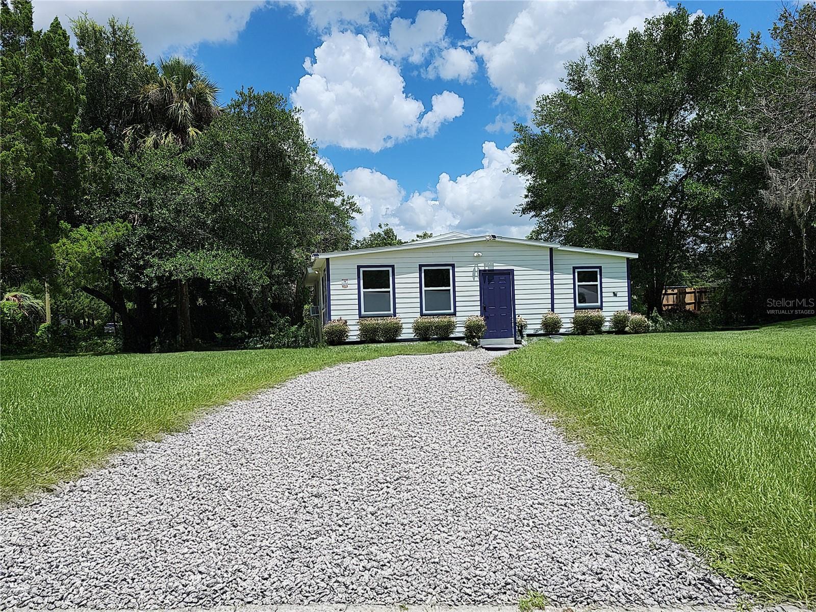 One or more photo(s) has been virtually staged. Welcome to this fully renovated, move in ready 3-bedroom, 2-bathroom home. This Crystal River home sits on a corner lot with just over a quarter acre of land. The yard has plenty of space to entertain and play in the shade, with its mature trees providing plenty of shade from the blazing Florida sun. The modern upgrades to this home provide comfortable living. The roof was replaced in 2023. The septic system was completely replaced, including the septic tank and drain field. The front porch was completely rebuilt from the ground up with a concrete foundation, new framing, natural wood ceiling and laundry hook-ups. The home's subflooring and flooring were all replaced. The pier and beam foundation was upgraded. New wood framing, and new concrete and hydraulic risers were installed. A brand-new subfloor and luxury vinyl plank flooring now extend throughout most of the home and ceramic tiles protect the two bathrooms. All exterior walls have new plywood sheathing and freshly painted wood siding. The entire plumbing system was replaced with all new water and drain lines. The electrical system was completely rewired with new switches and outlets installed. A new meter base and was installed. Exterior lights were added at every entrance for added safety and charm. The primary ensuite bath has an elegantly tiled walk-in shower with a large rain head and hose. The guest bath has a whirlpool style tube/shower combo with crystal clear glass doors and impeccable tile work. The kitchen has new appliances including an elegant in sink dishwasher with touch controls. Two brand-new air conditioning units efficiently cool the home and give you the option of zoned controls. The property also includes a powered shed with updated electrical service for the well, and a brand-new well pump. Access to the Gulf of America, the Crystal River, and fresh water springs is only a few minutes drive. You can enjoy yourself with plenty of boating, fishing, scalloping, or just relaxing at the local beach. Known as “Home of the Manatee” , the springs of Crystal River are home to many Manatees. Residents can kayak, paddleboard, or even swim alongside the Manatee in protected waters. The area is know for its preserves, forests, off roading trails. and wildlife refuges—perfect for those who love hiking, birdwatching, and offroad adventures. Bring your 4x4! Crystal River provides country living and calm pace but is still within driving distance to Tampa, Ocala, Spring Hill, and Gainesville. Weekend getaways, healthcare access, and shopping are easily within reach. Seize the opportunity to own a beautiful and peaceful property in one of Florida’s most beautiful and nature-rich communities. Schedule your showing today!