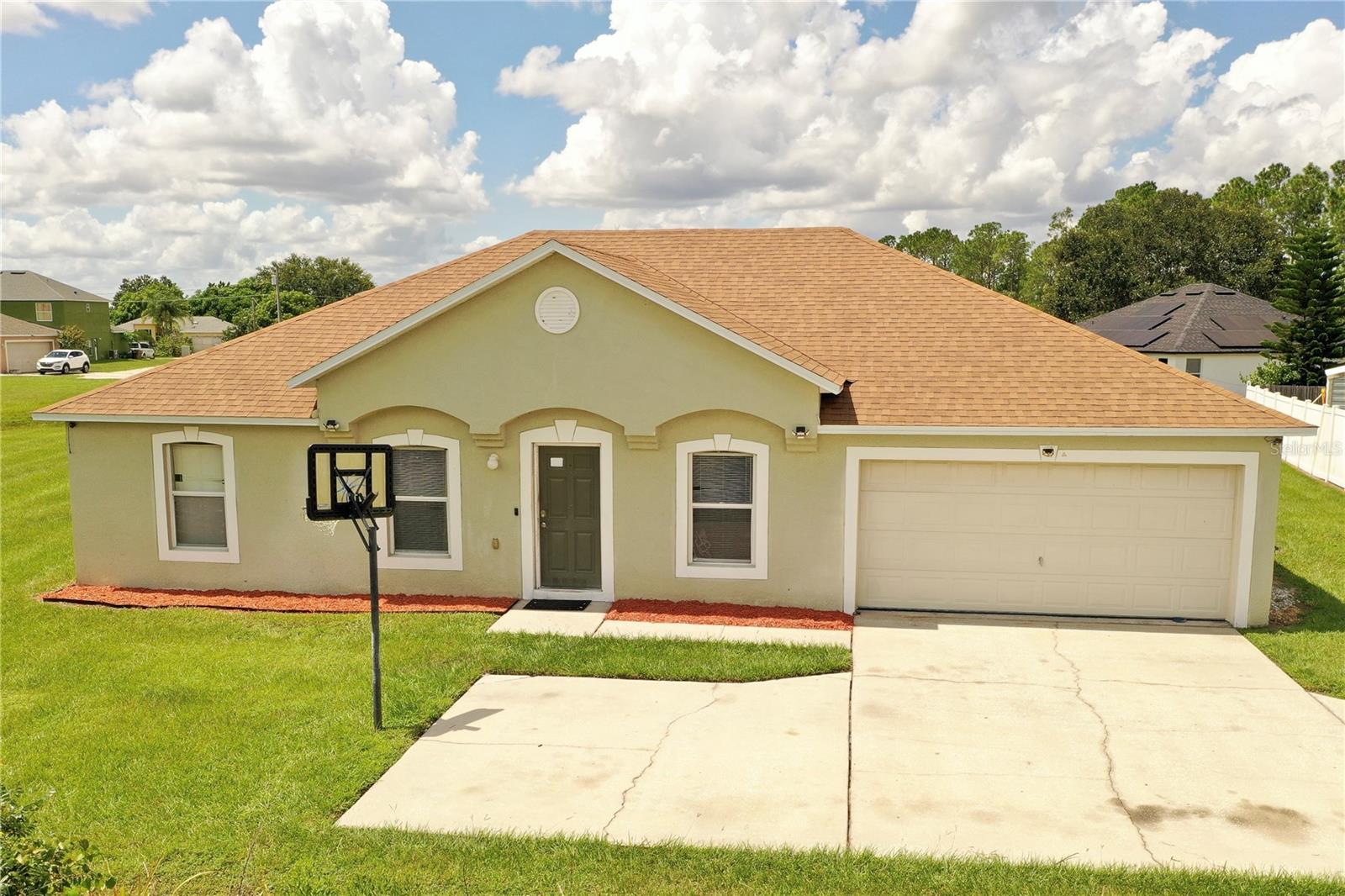 This home has everything you could want! Located in one of the finest areas of Poinciana, it offers easy access to the new highway, nearby hospital, shopping, and schools, all while being set on a private lot with a spacious backyard, side yard, and picturesque pond views. Built in 2005, this beautifully updated open-concept home features a split-bedroom layout. You'll love the modern touches, including granite countertops and brand-new tile flooring, among other upgrades! This property is truly move-in ready, offering a perfect blend of comfort, style, and convenience. Don’t miss your opportunity to make it yours—schedule a visit today!