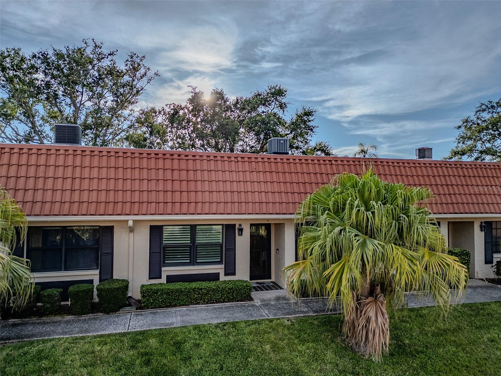 One or more photo(s) has been virtually staged. Coastal Comfort in Imperial Cove – 55+ Gated Waterfront Community
Step into the laid-back elegance of 19029 US Highway 19 N, Apt 18B—a beautifully updated 2-bedroom, 2-bath condo in the coveted Imperial Cove. While tax records list 1,150 sq ft, this home offers over 1,400 sq ft of bright, coastal-inspired living space.
From the moment you enter, soothing seafoam green walls, warm wood-look LVP floors, and natural light from skylights set the tone. The kitchen features stainless steel appliances that complement the airy, open feel. Updated windows with custom plantation shutters add a timeless Florida touch while providing style, privacy, and energy efficiency. Fresh paint and updated baseboards complete the refreshed look, while the AC was replaced in 2020 for peace of mind.
Enjoy a cozy dry bar for entertaining and step out to your updated back patio—perfect for a morning coffee or evening drink in the Gulf breeze. This home includes a washer and dryer, assigned covered parking, and a private storage unit conveniently located next to your parking spot. Best of all, it did not flood.
Imperial Cove delivers the ultimate resort-style lifestyle—heated pool, waterfront walking trails, fishing pier, clubhouse, fitness center, library, and game room—all inside a secure, gated community with partial water views. Here, every day feels like a vacation.
