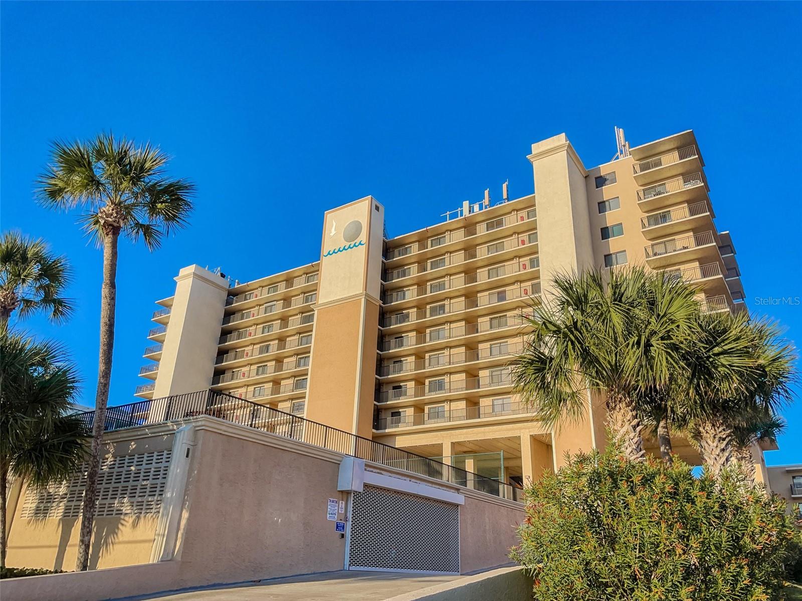 Welcome to B606 at Moontide Condominium in the beautiful coastal city of New Smyrna Beach, FL. This stunning oceanfront property offers an unparalleled opportunity to experience the ultimate beachside lifestyle. With its prime location and a plethora of amenities, this unit is truly a gem that boasts breathtaking panoramic views of the sparkling Atlantic Ocean. Imagine waking up every morning to the soothing sound of waves crashing against the shore and being greeted by mesmerizing sunrises from the comfort of your own home. This spacious three-bedroom, two-bathroom unit provides ample space for comfortable living. The open floor plan allows for seamless flow between the living room, dining area, and kitchen, creating an ideal setting for entertaining guests or simply enjoying quality time with loved ones. The well-appointed kitchen features modern appliances, sleek granite countertops, and plenty of storage space for all your culinary needs. Whether you're a seasoned chef or just enjoy preparing meals at home, this kitchen is sure to inspire your inner Chef. In addition to its interior charms, this property offers access to a range of desirable community amenities. Take advantage of the clubhouse where you can socialize with neighbors or host events. Cool off during warm summer days in the inviting community roof top pool or challenge friends to a friendly game on one of the tennis, pickleball, or shuffleboard courts. For those seeking an active lifestyle, there's also a fitness center available. Beyond the confines of this remarkable property lies an array of attractions and activities that make New Smyrna Beach such a sought-after destination. Known for its pristine beaches and vibrant surf culture, residents can indulge in various water sports such as surfing, paddleboarding, or simply lounging under an umbrella while soaking up the sun. The no-drive beach ensures tranquility and safety for all residents. New Smyrna Beach is also renowned for its charming downtown area, offering an eclectic mix of art galleries, boutiques, and delectable dining options. Explore the rich history of the city by visiting local museums or take a stroll along Flagler Avenue, where you'll find an abundance of shops and restaurants. Don't miss your chance to own this remarkable property. Contact us today to schedule a private showing and experience the allure of New Smyrna Beach living firsthand.