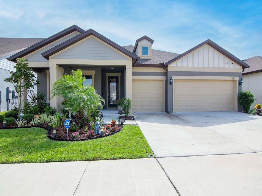 Welcome to this stunning 4 BR/3 BA home with an OFFICE/FLEX RM and 3 CAR GARAGE. The seller has added tons of builders' upgrades and many extras, which shows like a model home. This single story nearly new open floor plan is spacious from the moment you walk in with a stunning entryway the leads past the office and formal dining area into the open concept kitchen and living space. The kitchen has a large island, perfect for meals and entertaining, with excellent cabinet space, stainless-steel appliances, and tile back splash. The split floor plan allows for privacy with the owner's suite located along the backside of the home featuring a walk-in closet & en-suite bathroom. On the opposite side the 3 additional bedrooms, one with en-suite bath, is perfect for family or guests. Out back the covered patio has great outdoor living space and a large outdoor kitchen with loads of counter space.  It features a 5-burner propane grill with an electric smoker, sink, mini-fridge, and beverage chiller.  You will spend lots of time in the backyard, which has a privacy fence, a deck and plenty of room for backyard entertainment.  The amenity rich community of Ventana Groves offers a resort style zero entry community pool, clubhouse, splash pad and courts. There is a playground with sun sails, and lakeside walking trails. This location allows easy access to I-75, I4, and the Selmon Expressway that makes for an easy drive to world-renowned beaches, sports complexes, MacDill Air Force Base, Tampa Int'l Airport, and all the Tampa Bay area has to offer.