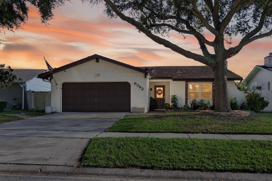 Welcome to your own private oasis in the heart of Pinellas Park! This beautifully maintained 2-bedroom, 2-bathroom home with a 2-car garage offers the perfect blend of comfort, style, and outdoor living.

Step inside to find a bright, open layout that’s perfect for entertaining or relaxing at home. The spacious living area features a cozy wood-burning fireplace, creating the perfect spot for relaxing evenings or gathering with friends and family. The living area flows seamlessly into the kitchen and dining spaces, offering a warm and inviting atmosphere. Both bedrooms feature brand-new wood flooring, adding a touch of elegance and warmth. The primary suite includes an en suite bath with direct access to the pool area, providing the ultimate convenience for a quick dip or easy outdoor entertaining.

Step outside and discover what makes this home truly special — your very own backyard retreat! Enjoy Florida living at its finest with a resurfaced saltwater pool, a tropical tiki bar, and a screened-in porch surrounded by lush, tropical landscaping that creates a sense of privacy and tranquility. The owner-owned solar panels and whole-house water softener system provide added comfort, efficiency, and long-term savings..

Located in a desirable Pinellas Park neighborhood, this home is just minutes from shopping, dining, parks, and some of Florida’s most beautiful beaches.

Whether you’re hosting friends poolside or enjoying a quiet evening under the stars, this home offers the perfect balance of relaxation and fun.