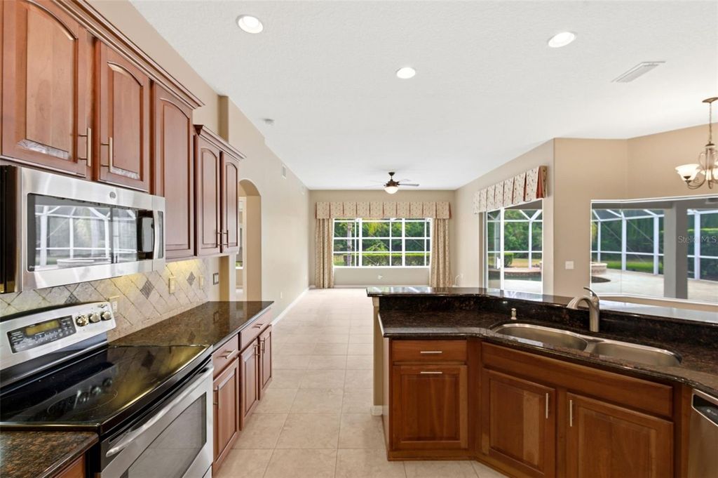 Photo of 1450 Warrington Way, Trinity, FL 34655 (MLS # W7883330)