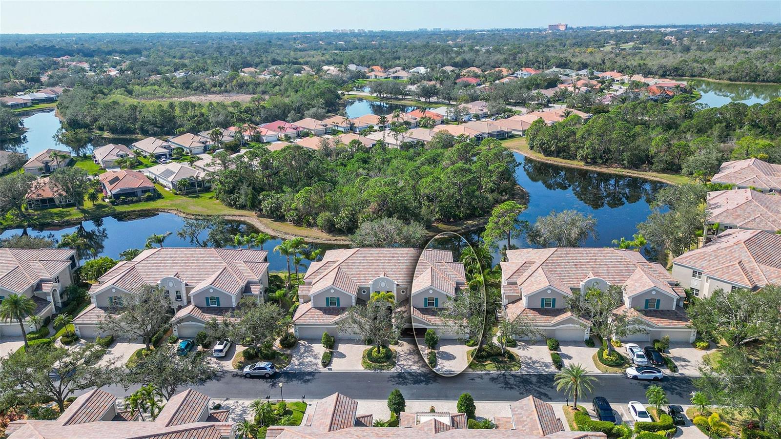Peaceful, quiet and private LAKEFRONT second-floor, end-unit residence in the sought-after Palmer Ranch community of Botanica offering a MAINTENANCE-FREE LIFESTYLE with the convenience of a PRIVATE ELEVATOR, taking you directly from your 2-CAR GARAGE to the main living level. The Wisteria floorplan is the largest in this well-maintained community and lives like a single-family home. A touch of elegance throughout with high ceilings, crown molding, tray ceilings, and custom plantation shutters. All NEW IMPACT WINDOWS being installed. Hurricane shutters provide peace of mind. A thoughtfully designed layout with an inviting great room featuring wood floors, modern electric fireplace, surround sound system and a custom wine/dry bar. The expansive screened balcony offers serene lake views, ideal for lounging and dining al fresco while enjoying private sunsets, wetland preserves and lush tropical landscaping. Spacious timeless kitchen with staggered solid wood cabinetry, brand-new quartz countertops and backsplash. With two separate dining areas, there’s plenty of space for entertaining or casual dining. The split bedroom floorplan provides privacy, with a primary bedroom overlooking the water, large walk-in closet, and a spa-inspired bath with split vanities, soaking tub, walk-in shower, and private water closet. Custom built-ins in the closets throughout maximize storage space. Perfect for year-round living or as a seasonal retreat. Botanica is a gated and maintenance-free community, surrounded by acres of preserve and lakes. Enjoy two community pools, one just a short walk away, gas grills for cooking and entertaining, and a 4,000 SF clubhouse with meeting rooms, catering kitchen, and a fitness center. The location is ideal, only 15 minutes from the world-famous Siesta Key Beach and close to downtown Sarasota’s shopping, dining, and vibrant cultural lifestyle. You’ll also have easy access to the Legacy Trail for biking and walking. Tucked away in a quiet setting within Palmer Ranch, yet with quick and easy access to all that Sarasota’s Gulf Coast has to offer! SELLER WILL CONSIDER ALL OFFERS.