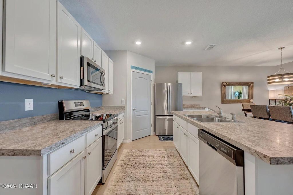 Photo of 136 Old Mill Pond Road, Edgewater, FL 32141 (MLS # O6380086)