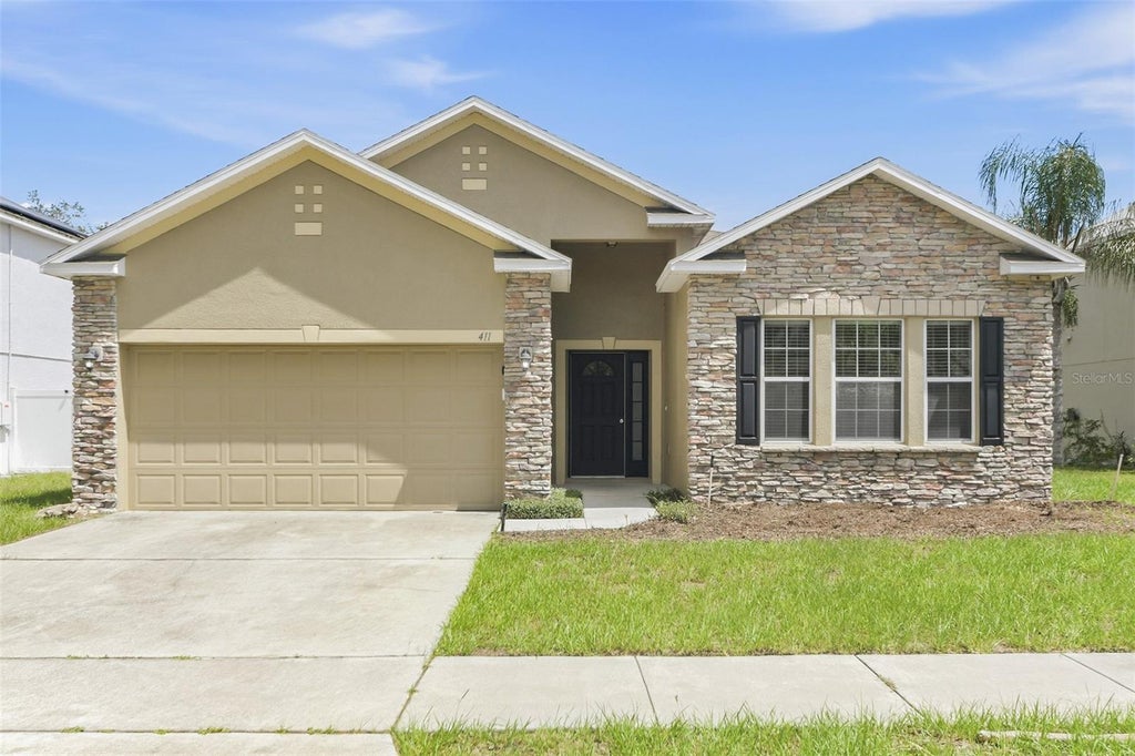Photo of 411 Hammerstone Avenue, Haines City, FL 33844 (MLS # O6445428)