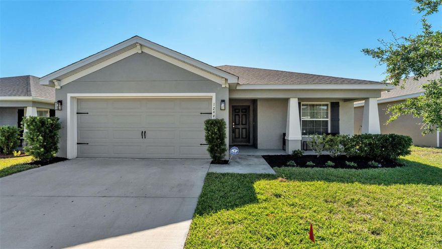 The Parker Model by Highland Homes in the Enclave at Lake Myrtle! Completed in 2022, this beautifully maintained 4-bedroom, 2-bath home offers 1,715 heated square feet of comfortable living space with a light, bright, and open layout designed for everyday living and easy entertaining.

The spacious great room/kitchen plan creates a welcoming central gathering space, featuring a large kitchen island ideal for meal prep, casual dining, and conversation. The kitchen also offers raised-panel cabinetry, stainless steel appliances, a double sink, walk-in pantry, and convenient access to the inside laundry room. Just off the kitchen, the café-style dining area features sliding glass doors that open to the screened lanai and backyard.

The private owner’s suite provides a relaxing retreat with a spacious bedroom, garden tub, private water closet, and large walk-in wardrobe. Three additional bedrooms offer flexibility for family, guests, a home office, or hobby space.

Enjoy quiet mornings or relaxing evenings on the charming 19' x 6' rocking-chair front porch, or unwind on the screened lanai overlooking the backyard. Additional features include a custom TV mount that will remain, irrigation system, and more. Please note: shelves in the great room do not convey.

Located in Auburndale with easy access to I-4 and the Polk Parkway via Berkley Road, this home offers comfort, convenience, and a wonderful Central Florida location.