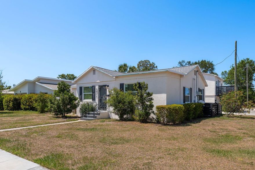 DUAL INCOME OPPORTUNITY IN SUNNY ST. PETERSBURG

This multi-family property offers the perfect blend of comfortable living and investment potential on an oversized corner lot. The main residence boasts 4 bedrooms, 2 bathrooms, and a versatile study/den, providing ample space for family living or hosting guests.

Step into the main unit and discover a welcoming large foyer leading to a comfortable 14.9 x 11 living room. The spacious kitchen features elegant stone countertops, updated cabinetry, and modern appliances—perfect for the home chef. Both bathrooms have been tastefully updated to reflect contemporary design while maintaining practical functionality.

The separate second unit is a charming 1 bedroom, 1 bathroom apartment with its own updated bathroom and renovated kitchen. This turnkey rental offers immediate income potential while you enjoy your main residence.

Outdoor enthusiasts will appreciate the fenced yard providing privacy. There's even dedicated space for parking your recreational vehicle and boat—a rare find in urban properties!

This dual-purpose property presents a unique opportunity to offset your mortgage with rental income while enjoying the benefits of homeownership. Live in one unit while renting the other, or utilize both spaces for extended family living.

Located in a desirable St. Petersburg neighborhood, you'll enjoy proximity to shopping, dining, parks, and the beautiful Gulf beaches that make Florida living so special. This versatile property offers the perfect combination of lifestyle and investment potential.