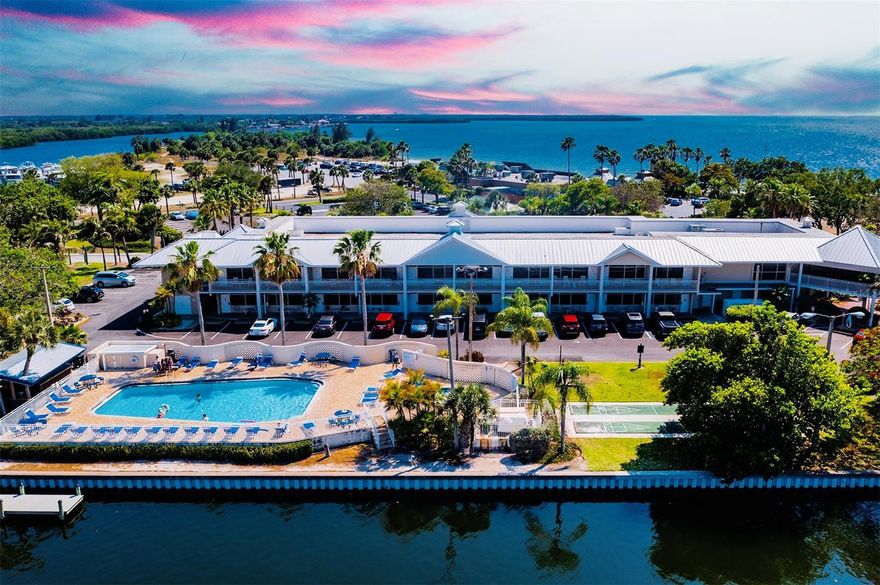 Welcome to your coastal retreat at Little Harbor! This charming and well-maintained studio condo offers the perfect blend of relaxation, convenience, and resort-style living. Whether you’re seeking a second home, an investment property, or a peaceful weekend getaway, this waterfront community delivers an exceptional lifestyle.

The open studio layout feels bright and inviting, featuring one king bed, a spacious sitting area, and room to unwind after a day in the sun. Large windows bring in natural light and create a comfortable, serene atmosphere. With its efficient design, the condo is ideal for short-term stays, extended vacations, or hosting guests.

Enjoy Resort-Style Amenities Just Steps Away
Step outside to scenic sunset and bay views, where you can observe marine life and watch boats pass by. Relax on your porch with your morning coffee or take a short walk to the community’s private sandy beach, perfect for swimming, lounging, and enjoying the coastal breeze.

Little Harbor is known for its outstanding amenities, including:
• Two heated community pools
• Beachfront tiki bar with live music and sunset views
• Pickleball Courts, Tennis courts, fitness center, and playground
• Deep-water marinas with direct access to Tampa Bay and the Gulf
• Nearby Freedom Boat Club for convenient boat rentals
• Kayaking, paddleboarding, canoeing, and other water activities available within the community

This unique combination of water access, recreation, and natural beauty creates a relaxed coastal lifestyle that appeals to both residents and vacationers.

Convenient Location + All-Inclusive Fees
Ideally located near restaurants, shopping, entertainment, and a nearby hospital, the condo offers both convenience and tranquility. Monthly fees include water, electric, parking, cable, internet, and full access to all amenities—making it an easy, low-maintenance ownership experience.

A Great Opportunity in a Waterfront Community
Whether you’re investing, vacationing, or enjoying Florida living full-time, this condo offers exceptional value in a highly desirable resort setting. Don’t miss your chance to experience the Little Harbor lifestyle—schedule your private showing today!