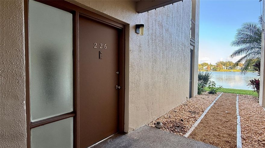 WATERFRONT! Ground floor unit on Lake Orienta in Sandy Cove Condos. This unit offers THE best view of the sunrise and Lake Orienta.  Step out your back screened patio to paddle board, canoe/kayak, fish and/or boat-you can pull right up to YOUR shore! Interior, great room floorplan features a large living room, dining area, kitchen w/stainless steel appliances, under cabinet lighting, quartz countertops, lazy susan pantry cabinet, breakfast bar & trash/recycle bin cabinet, utility closet, linen closet, large bedroom w/huge walk-in closet, and a nice bathroom w/recessed lighting, glass shower shelving, upgraded towel rack & quartz countertop. Entire interior has brick-pattern tiled floors. Enjoy the fully screened patio overlooking the lake and your Florida native landscaping! Community offers terrific laundry room, tennis courts, multiple swimming pools, pier, grill/picnic areas and gazebos, volleyball courts, parking for boat/jet ski trailers, clubhouse that can be reserved for gatherings & a beautiful lake view from almost everywhere. Unit is walking distance to Florida Hospital, Publix, the mall, Crane's Roost Park & TONS of other everyday amenities & entertainment! EQUAL HOUSING OPPORTUNITY.