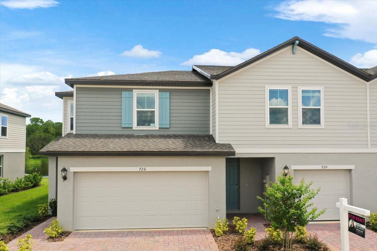 All appliances are included! This brand-new End townhome, with premium LAKE VIEW, features 3-beds, 2.5-baths, 2-car garage nestled in the prime location of Champions Gate offering an exceptional living experience. This *energy-efficient* home featuring 15 SEER AC, & dual pane low-E windows. This new community is a SHORT DISTANCE from I 4, with an abundance of retail, dining, major employment centers, and recreation areas, including Walt-Disney World, Universal Orlando, Omni Resort, Posner Park, and Celebration. As you walk inside, you'll be greeted by an open-concept main level that combines style and functionality. The spacious layout creates an ideal space for entertaining, with the kitchen island serving as the perfect centerpiece for gatherings with friends and family. Prepare delicious meals while staying engaged with your guests, making memorable moments. On the upper level, you'll be greeted by a thoughtfully designed space that caters to your convenience. A laundry room equipped with a full-size washer and dryer makes the task of managing your household a breeze. Additionally, a versatile loft area provides a flexible space that can be utilized to suit your needs, whether as a cozy relaxation spot, a home office, or a play area. The Owner’s Suite offers a serene sanctuary featuring a generously sized walk-in closet to accommodate your wardrobe and belongings. The owner’s bathroom features a spacious Walk-in Shower, dual sink, Quartz counters, and built-in shelving. Two additional bedrooms share the guest bathroom. The home has elegant interior finishes including 42” cabinets, Quartz counters, ceramic tile on the main level and all wet areas, and carpet in the bedrooms. 2 ”faux wood blinds come in every room. Enjoy Florida living at its best. Requirements: Stable job with proof of income.