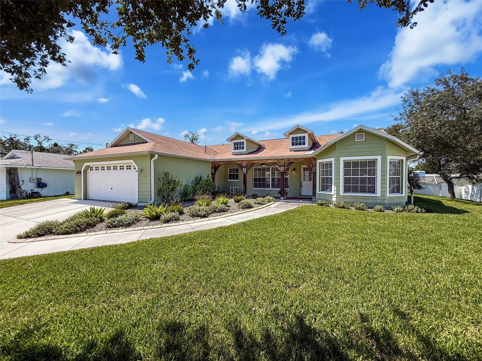 Welcome to your Florida dream home! This spacious 3-bedroom, 2.5-bath home offers 1,709 sq. ft. of comfortable living space (2,600 sq. ft. total) on a generous 1/3-acre lot in the heart of Spring Hill. A brand new roof will be installed with an approved contract, providing peace of mind for years to come! From the moment you arrive, you'll fall in love with the charming porch, perfect for relaxing with your morning coffee or winding down in the evening while enjoying the quiet neighborhood. Step inside to discover an open, inviting layout featuring a double walk-in shower in the master suite, a large pantry, and a bright kitchen with new stainless steel refrigerator, propane gas cooktop, double wall oven, double sink, and a convenient breakfast bar. All major appliances, including washer and dryer, are included! Enjoy the Florida lifestyle year-round with your propane-heated screened-in pool, expansive covered lanai, and well-maintained sprinkler system. Hurricane shutters provide added protection, and all windows come with blinds for privacy and comfort. The home also features a two-year-old hot water heater and a 2013 A/C unit that's been well maintained. With plenty of curb appeal, a thoughtfully designed layout, and tons of extras, this home is truly move-in ready. Don't miss this incredible opportunity—schedule your private showing today!