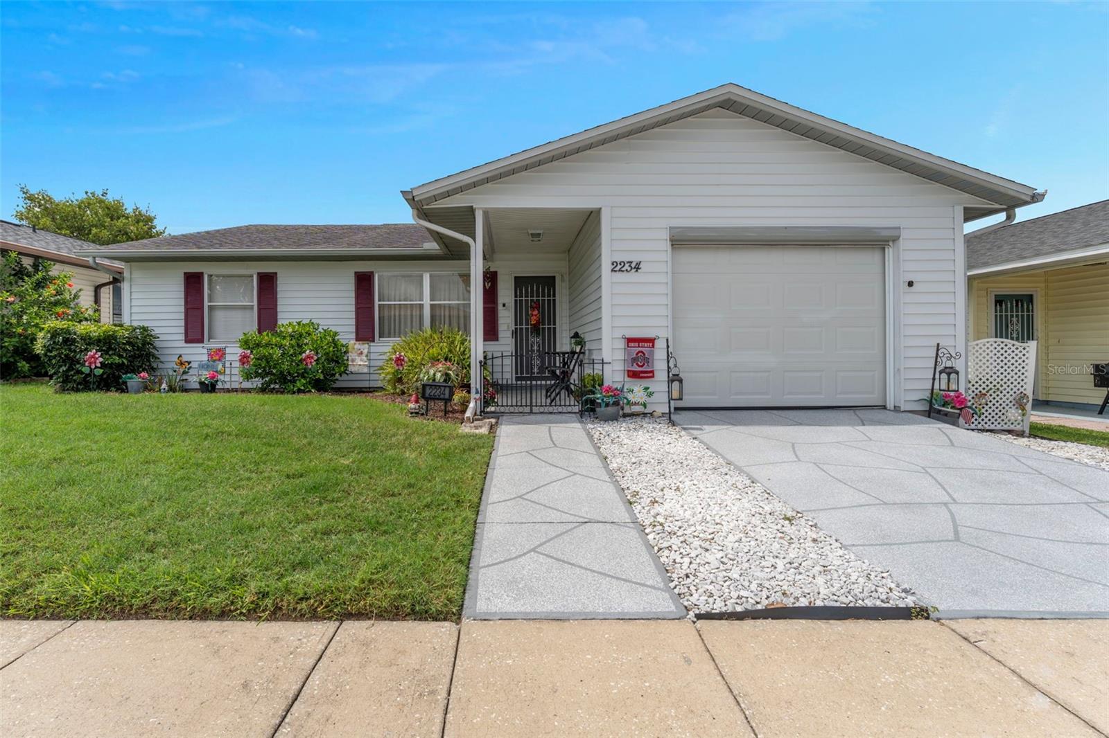 Charming two bedroom/2 bath home in the very popular retirement golf community of Highland Fairways. You will appreciate the size of the living room as you enter though the front door. Walk on through to the beautifully updated large eat-in kitchen. Granite counters, LARGE eating area, lots of storage and newer appliances . . . microwave (2 yrs old), refrigerator (4.5 yrs old), garage refrigerator (7 yrs old), stove (7 yrs old), dishwasher (7 yrs old), garbage disposal (3 yrs old), washer (4 yrs old), dryer (7 yrs old). A/C 2018, Hot water 2017, Roof, 2020. As you can see, there's lots and lots of NEW in this well loved property. Along side of the one car garage driveway is the perfect spot for your golf cart. The back of the house has an enclosed 'Florida Room' with a door leading out, as well as sliding windows for lots of sun and a cool breeze. It also features window shades for when you've had enough sun and would appreciate a bit of shade and privacy. This is a lovely home that you want to put on your must see list. At this price, it won't be here for long.