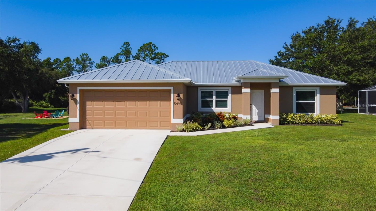 WELCOME HOME!!! Almost new, why wait to build when you can move right into this beautiful Gulfstar home built in 2022. This home was unscathed in all 3 hurricanes, Ian, Milton and Helene, for an added piece of mind the sellers had a BRAND NEW METAL ROOF in November 2024 that includes a 10/45 yr transferable warranty!!!
This immaculate 3 bedroom, 2 bath home with a 2 car garage offers 1437 sq ft. From the moment you enter the front door, you will appreciate this well built home. The main space features vaulted ceilings, an open floor plan, recessed lighting, IMPACT RESISTANCE WINDOWS AND DOORS, and porcelain tile flooring throughout. The chef's kitchen features gorgeous granite, solid wood white cabinets with soft closing hardward, beautiful white subway tile backsplash and SS appliances. This home features a huge island with SS sink, kitchen reverse osmosis and plenty of seating for entertaining. The sellers are leaving the bar stools and dining table and chairs since they match so well with the kitchen!! The primary bedroom features a HUGE walk-in closet and an en-suite bath with dual sinks, granite countertops and a stunning walk-in shower. The 2 guest bedrooms provide ample closet space with sliding closet doors, ceiling fans with lighting and porcelain tile. The guest bathroom features newly tiled shower with custom glass sliding doors and a wood vanity with granite countertop. The open-concept living and dininig area flows seamlessly, making it perfect for entertaining and family gatherings. The sliding glass doors lead to the screened in lanai featuring a ceiling fan- perfect for enjoying our Florida weather. This home is NOT in a flood zone and is nestled among newer homes!!!
