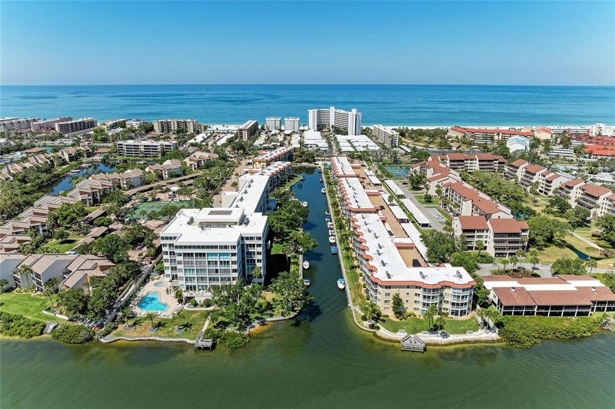 Bring your boat and dock steps from your back door.. Turnkey living in Siesta Harbor, a 55+ waterfront community, with beautiful canal water views and private beach access. This fully renovated 1-bedroom, 2-bath condo offers an open floor plan, updated kitchen and bathrooms, newer impact sliding doors, and a newer HVAC system (2021). Enjoy peaceful water views from the enclosed lanai as boats pass by.

Boat slips are available for vessels up to 30’, with dockage approximately $1,000 annually (buyer to verify with Harbor Master). This property is also investment-friendly, allowing monthly rentals, and has a strong rental history (buyer to verify current rental restrictions and income).

Community amenities include a heated waterfront pool, fishing pier, fitness center, clubhouse, shuffleboard, and busy social calendar. Additional features include assigned covered parking and private storage. Located just steps to beach access through Crescent Arms and close to dining, shopping, and the Siesta Key trolley.

Ideal as a full-time residence, seasonal retreat, or income-producing property.