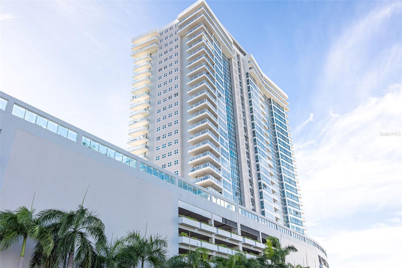 Modern, stylish, and impeccably maintained, this fully furnished 1,777 sq. ft. apartment is located on the 22nd floor of Aquablue at the Golden Mile Condominium--ideally situated in the heart of San Juan's financial and commercial district, just 10 minutes drive from Condado.
The residence features 2 bedrooms, 2.5 bathrooms, and a sleek, contemporary kitchen with clean lines and high-end finishes. The primary suite includes a spacious walk-in closet and a well-appointed ensuite bathroom with a jetted tub and separate shower.
An open-concept layout connects the living and dining areas, highlighted by floor-to-ceiling windows that flood the space with natural light. Step out to a private balcony and enjoy expansive, unobstructed views of the city skyline from one of the building's highest vantage points.
Aquablue offers a full range of amenities, including concierge service, 24/7 security, full backup generator, water cistern, swimming pool, fitness center, private covered parking, visitor parking, and two EV charging stations.
A rare opportunity to rent a turnkey residence in one of San Juan's most dynamic and desirable locations. Showing now!