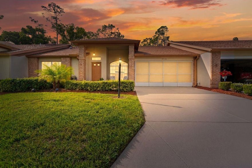 One or more photo(s) has been virtually staged. Welcome to 9726 Sweeping View, where every detail hits and the view steals the show. Set inside Timber Greens 55+ Community, this fully reimagined villa commands a prime position on the 12th fairway, overlooking a serene pond and manicured green. The moment you walk through the door, you feel it—this isn’t just updated, it’s Different.

The kitchen is a standout, boasts newer shaker cabinetry, crisp subway tile, deep basin sink, sleek granite countertops, and stainless appliances that tie it all together. Both the primary and guest bathrooms have been thoughtfully upgraded with modern LED touch mirrors, new vanities, and sleek frameless glass enclosures—clean, contemporary, and built to impress. Step outside to your extended lanai and custom paver patio—designed for entertaining or unwinding. It’s the perfect setting to take in the view of the green and watch golfers in the distance.

All set within a gated, amenity-rich community with golf, clubhouse, resort-style pool, tennis, dining, and a lifestyle that truly delivers.