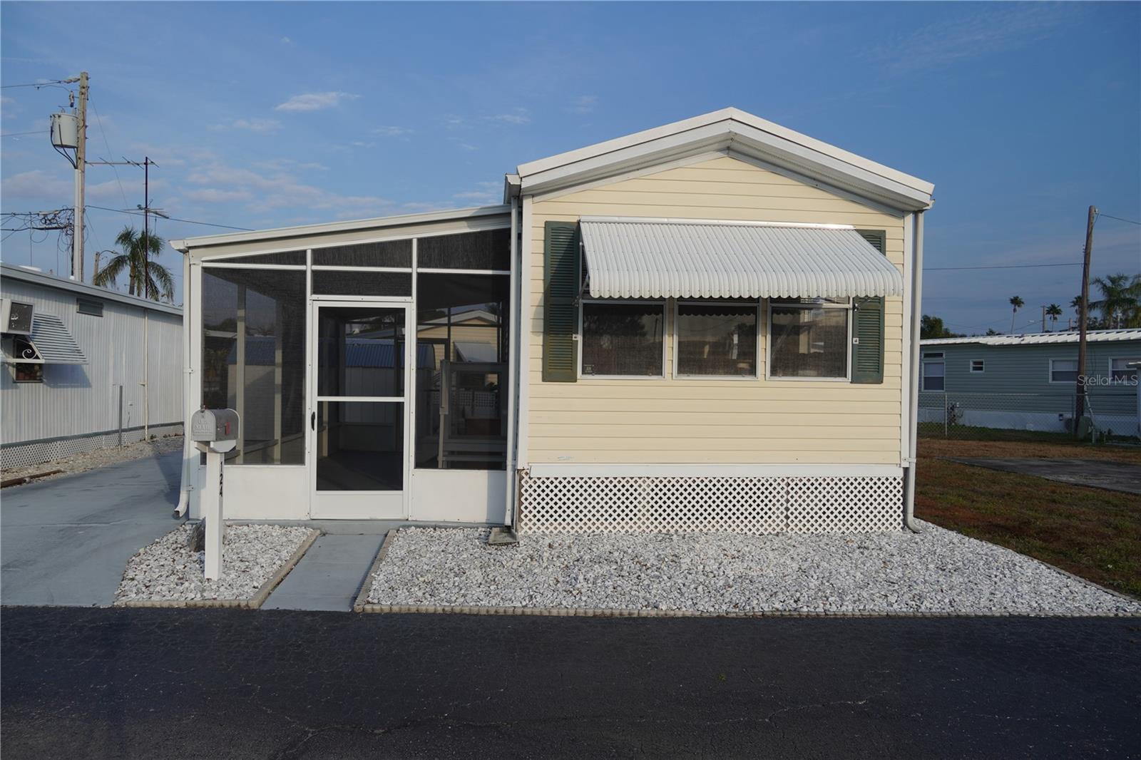 This is a RESIDENT OWNED COMMUNITY, NOT LOT RENT.
Located in a sought-after, 55+ Age Required Retirement (Resident Owned) Community that is close to shopping, dining, entertainment, medical facilities and our beautiful beaches.
Built in 1998, this partially furnished home is a 1-bedroom, 1-bathroom. It has new drywall, fresh paint, new ceiling fans, membrane roof over, new subfloors & luxury vinyl tile flooring. One of the best things is you have a very large green space located next to the home which means no neighbor there!
The living room has vaulted ceilings, large windows, new ceiling fan, luxury vinyl plank flooring and access to the screen in porch through the sliding glass door. The kitchen has plenty of cabinets, pantry, and a corner sink with a window over it (this is a great spot for your indoor herb garden), and a pass through to the living room so you can still be part of the conversation when entertaining friends/family.
The bathroom has a vanity with storage, medicine cabinet, a built-in cabinet over the toilet and a tub/shower combination.
The bedroom has a large window, vaulted ceiling, a ceiling fan, large wardrobe and fresh neutral paint.
The large screened in porch is accessible from the front of the home and from the living room, this is a great spot to enjoy your morning cup of coffee/tea or to spend time with your friends/family.
The large shed is at the rear of the home with built-in shelving to give you lots of extra storage space.
The current base HOA fee is $120.00 a month.
Suncoast Mobile Manor is a Resident Owned; 55+ Age Required Retirement Community. With a low HOA fee that covers water, sewer, and trash, this home is an affordable option with great amenities. The community is conveniently located just minutes from shopping centers, restaurants, and a short drive to the Madeira Gulf Beaches only 15 minutes away, and St. Pete's vibrant downtown events is just a short drive from your door.