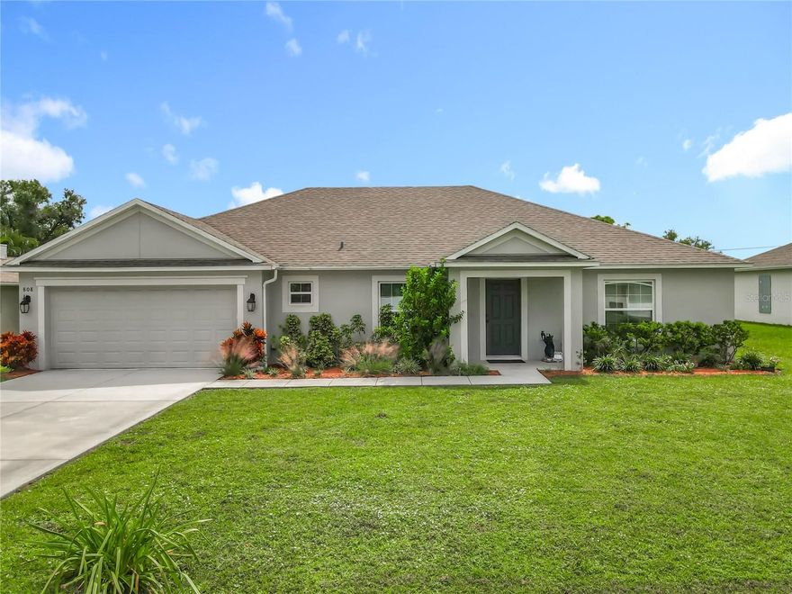AMAZING OPPORTUNITY IN PALM BAY! LIKE NEW and built in 2021, this spacious 4-bedroom, 2-bath home offers over 2,000 SqFt of living space! The open-concept layout features a modern kitchen, stainless steel appliances, and vinyl flooring throughout for easy maintenance. The split-bedroom design ensures privacy for the primary suite, complete with a walk-in closet and dual-sink bathroom, while the remaining bedrooms share a full guest bath. Enjoy a large backyard with a covered patio perfect for outdoor dining, lounging, or gardening. Conveniently located near Malabar Road, public transportation, schools, and I-95, and less than 30 minutes from the Brevard Zoo, Indian River, and Melbourne Beach. Just 5 minutes from Walmart! this move-in-ready gem is waiting for you!!