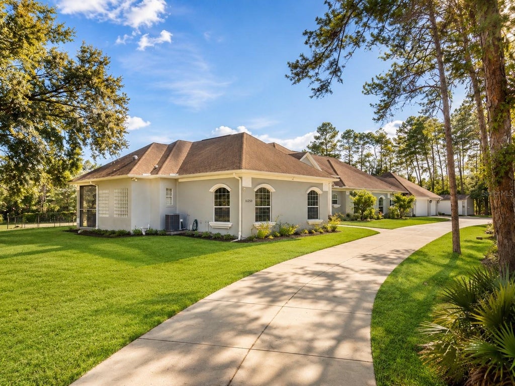 Photo of 11200 Woodland Waters Boulevard, Weeki Wachee, FL 34613 (MLS # W7888704)