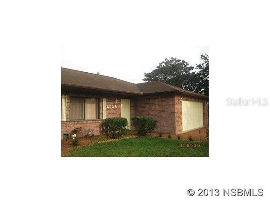 LARGE CUSTOM BUILT 3 BEDROOM 2 BATH HOME ON 3 LOTS. READY TO MOVE INTO. THIS HOME GIVES AN OPEN FEELING WHEN YOU STEP INTO THE LIVING ROOM WITH HIGH CATHEDRAL CEILINGS AND A VIEW TO THE BACK YARD. SPACIOUS KITCHEN WITH A BREAKFAST BAR, DINING ROOM AREA HAS A SLIDING GLASS DOOR THAT LEADS OUT TO AN ENCLOSED 10 x 20 PORCH. HOME FEATURES A SPLIT FLOOR PLAN, LIGHTED PLANT SHELVES THAT ENHANCE THE VAULTED CEILINGS, SEPARATE UTILITY ROOM, OVERSIZED 2 CAR GARAGE, BEAUTIFUL FOUNTAIN IN FRONT LAWN, STORAGE SHED, HURRICANE SHUTTERS AND ROOM FOR A POOL. ORIGINAL OWNER. A WONDERFUL HOME ATO LOVE IN AND PERFECT FOR ENTERTAINING. MINUTES TO THE BEACH, SHOPPING, AND I 95. PRICED TO SELL. A MUST SEE. ;Water: City