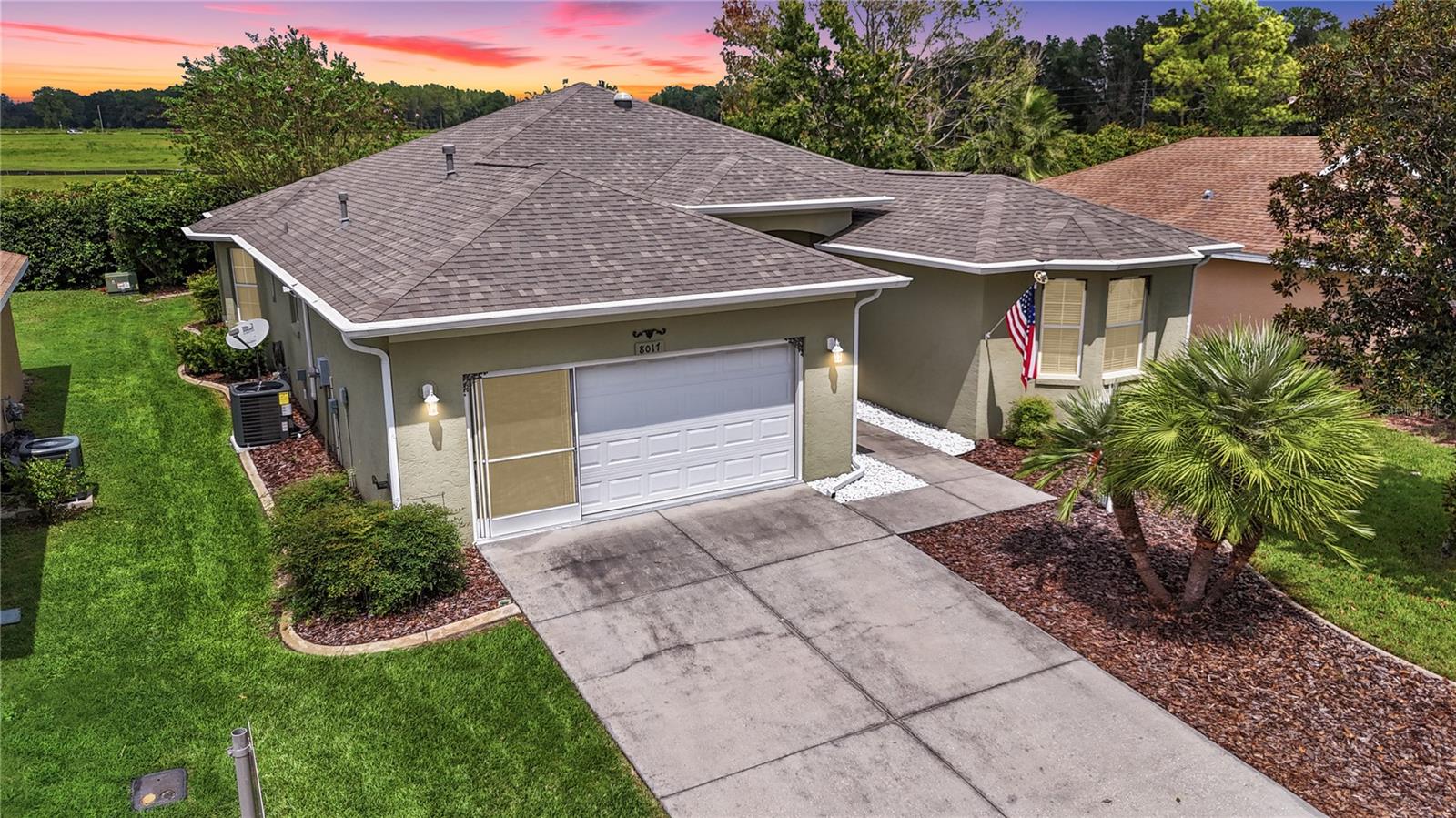 ABSOLUTELY STUNNING HEATHER MODEL WITH EVERYTHING FROM FLOORING TO ROOF NEW SINCE 2024!! ENTER INTO THE OPEN LIVING AND DINING AREAS WITH HIGH CEILINGS COMPLETELY REDONE WITH LUXURY PLANK VINYL FLOORING, ALL LIGHT FIXTURES PLUS DINING AREA FEATURES CHAIR RAIL AND LIVING ROOM HAS A BEAUTIFUL REMOTE CONTROLLED ELECTRIC FIREPLACE. TRIPLE GLASS SLIDERS LEAD TO AN ENCLOSED LANAI WITH CHATAHOOCHEE RIVER ROCK FLOORING AND CEILING FAN. A WONDERFUL YEAR ROUND OASIS. OR YOU CAN GO ON TO THE BIRD CAGE WITH PAVERS PERFECT FOR ENJOYING YOUR YARD AND FLORIDAS BEAUTIFUL WEATHER. THE KITCHEN IS A CHEFS AND ENTERTAINERS DREAM WITH EXTRA HEIGHT CABINETS, POT DRAWERS, 3 STOVES AND A MICROWAVE IN ADDITION TO DOUBLE DRAWER DISHWASHER, FRENCH DOOR REFRIGERATOR WITH TWO ICE MAKERS AND SO MUCH MORE. EXTENSIVE TILE BACKSPLASH IS NOT ONLY GORGEOUS BUT FUNCTIONAL AS IS THE REVERSE OSMOSIS SYSTEM AND PANTRY. BREAKFAST NOOK WITH BAY WINDOW ADDS LOADS OF LIGHT AND THERE IS THE EAT AT BAR TOO! FAMILY ROOM OPEN TO THE KITCHEN MAKES FAMILY GET TOGETHERS AND ENTERTAINING WONDERFUL WITH EVERYONE ENGAGED AND HELPING. THE GUEST WING HOUSES TWO BEDROOMS THAT ARE NICE SIZE WITH GENEROUS WALL CLOSETS AND ONE EVEN HAS A BAY WINDOW PLUS THEY SHARE A FULL BATH THAT IS LOVELY. THE PRIMARY BEDROOM IS SPACIOUS AND FEATURES TWO WALK IN CLOSETS AND A FULLY REMODELED BATH WITH DOUBLE SINKS, FANTASTIC STORAGE, SEPARATE TOILET ROOM AND STEP IN SHOWER. THE INSIDE UTILTY HAS STORAGE CABINETS, A UTILITY SINK AND IN CONVENIENTLY PLACED BETWEEN THE GARAGE AND KITCHEN. TO MAKE IT EVEN BETTER THE LIGHTS ARE AUTOMATIC SO WHEN YOU COME IN WITH YOUR HANDS FULL OF GROCERIES THE LIGHTS TURN ON FOR YOU. THE GARAGE DOOR HAS BEEN INSULATED AND THERE IS A PULL DOWN STAIR FOR THE ATTIC ACCESS. NOTHING HAS BEEN OVERLOOKED IN THIS MAGNIFICENT HOME…ALL IT IS MISSING IS YOU!