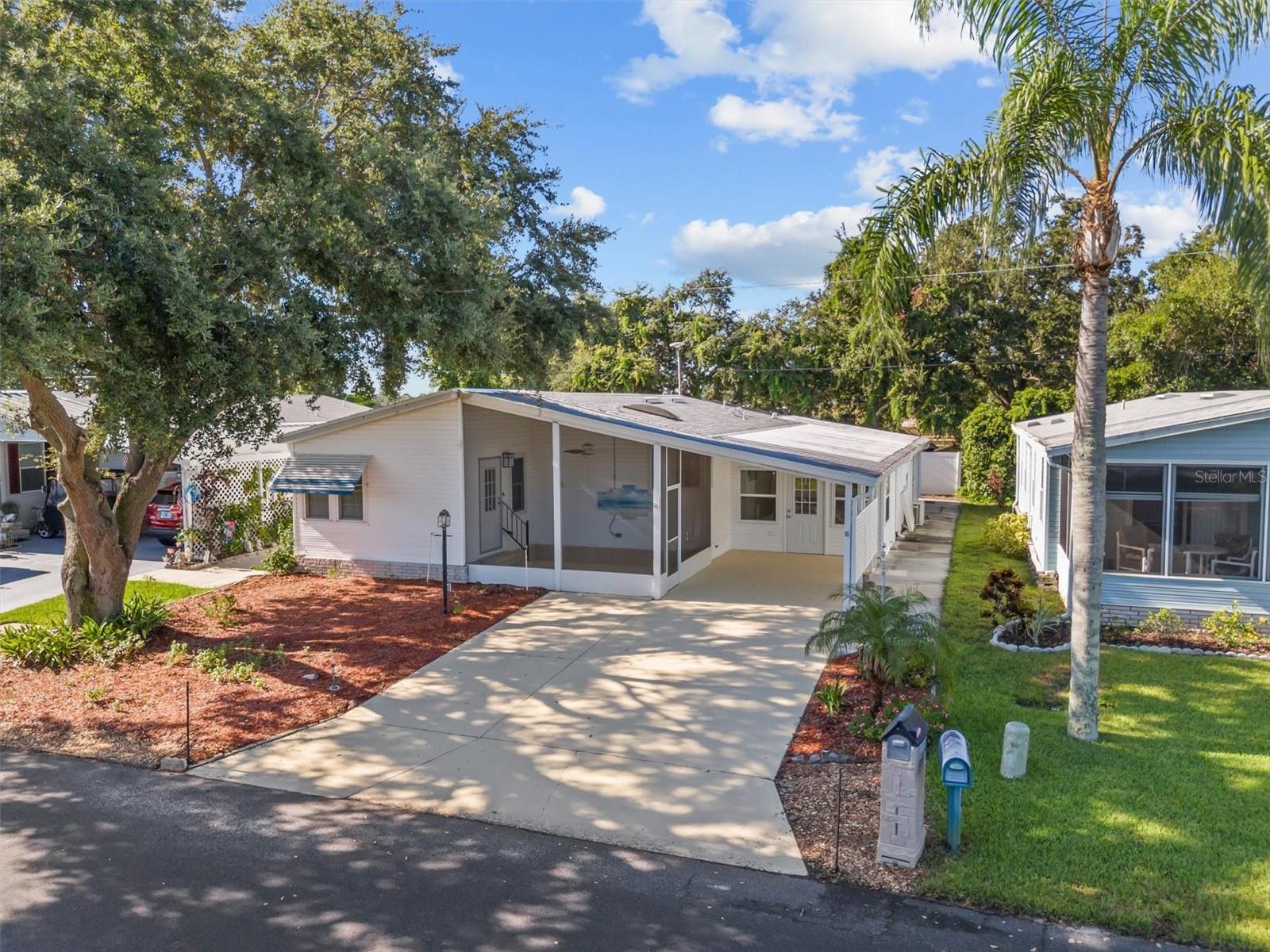 Welcome to 6084 Southern Oaks Dr, a spacious and beautifully updated manufactured home on OWNED LAND nestled in the desirable 55+ community of Garden Grove Oaks in Winter Haven. This 3-bedroom, 2-bathroom property offers an exceptional amount of living and storage space, with a layout designed for both comfort and versatility. In addition to the main living areas, you'll find two screened porches—one in the front and one in the back—a large tiled Florida room, and a bonus room located at the front of the home, perfect for a home office, hobby space, or additional seating area.
The fully remodeled kitchen features granite countertops, updated cabinetry, a gas stove, and a Bosch dishwasher, providing a stylish and functional space for cooking and entertaining. Both bathrooms have been tastefully updated, and the home has been replumbed for added peace of mind. The Florida room and the third bedroom each offer their own split AC unit for personalized comfort, and the third bedroom also includes a Murphy bed that will stay with the home—ideal for guests or flexible use of the space.
Throughout the home, updated luxury vinyl plank flooring creates a warm, modern feel, while ceramic tile adds durability and style to the Florida room and third bedroom. The roof was replaced approximately two years ago, adding to the home's long list of recent improvements.
Located in Garden Grove Oaks, residents enjoy a vibrant lifestyle with access to a community pool and a clubhouse that overlooks peaceful water views. With close proximity to restaurants, shopping, churches, and medical facilities, and centrally located between Tampa and Orlando—just 1.5 to 2 hours from either coast—this home offers the perfect balance of convenience and tranquility. Don’t miss your opportunity to make this exceptional property your own.