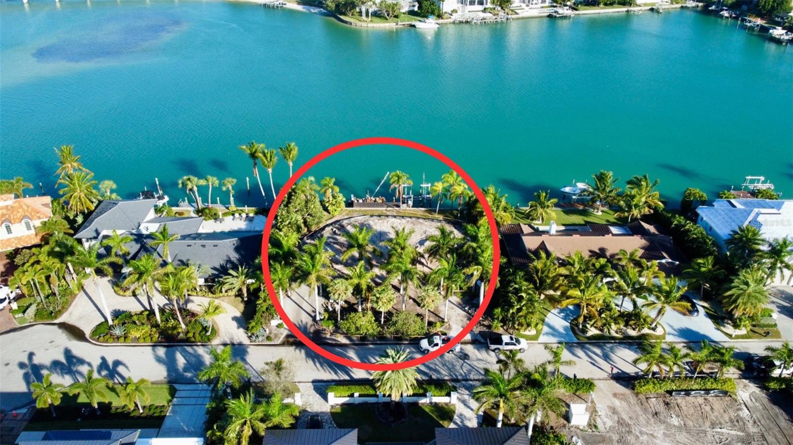 Seize the rare opportunity to build your dream home on one of Sarasota’s most coveted locations. This exceptional deep-water lot on Bird Key offers 120 feet of prime waterfront, complete with a concrete seawall and the ability to accommodate a large vessel with 6’-7’ of water depth at low tide. This is truly a boater’s paradise.Imagine waking up to breathtaking panoramic bay views each day, surrounded by the beauty of nature and abundant wildlife. Dolphins, manatees, sea turtles, and a variety of fish species are frequent visitors at your seawall, enhancing the tranquil charm of this remarkable location.Situated on a peaceful cul-de-sac, the lot is just moments from the prestigious Bird Key Yacht Club and Marina, which provides deep-water docks, fuel services, tennis facilities, and a restaurant. This exclusive community offers the perfect balance of privacy and convenience, with quick access to downtown Sarasota, St. Armands Circle, and the world-famous white sand beaches of Lido Key. Enjoy easy access to upscale dining, shopping, and cultural attractions that Sarasota is known for.This prime location provides the ideal setting whether you dream of creating a grand estate or a cozy waterfront retreat. The lot is ready for construction as the previous home has been razed and soil tests have been completed, streamlining your building process. If desired, the current owner is also open to offering a custom new home package. Don’t miss out on this incredible opportunity to own a piece of paradise in one of Sarasota’s most prestigious neighborhoods.