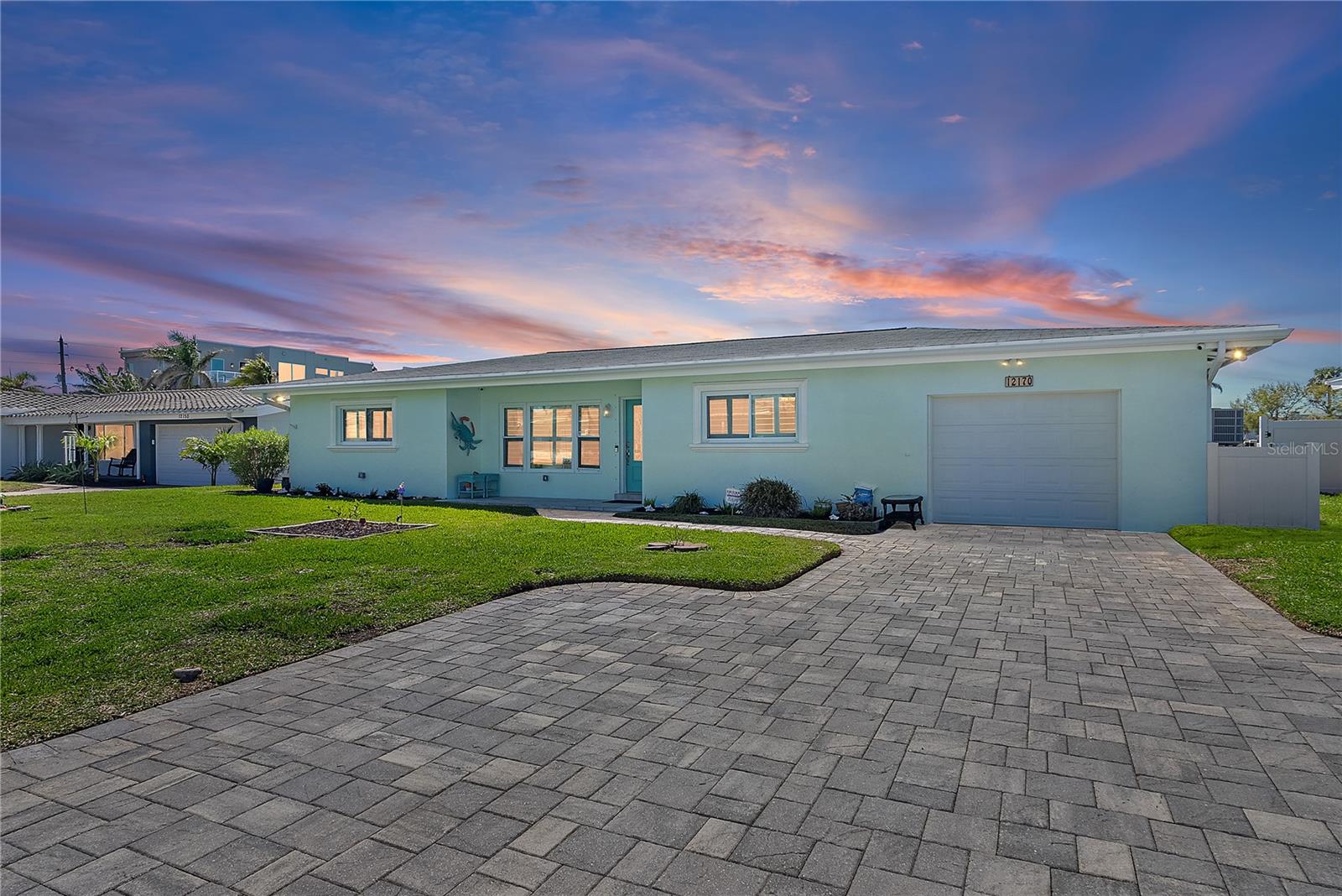 Move-In Ready Waterfront Ranch Home on Isle of Capri – Treasure Island, FL ... Welcome to your waterfront paradise on the highly sought-after Isle of Capri in Treasure Island, FL! ... This long-time, family-owned and loved single-family ranch-style home offers the perfect blend of coastal charm, modern upgrades, and direct boating access to the Gulf of Mexico and the Intracoastal Waterway... Boasting 80 feet of reinforced seawall, a private dock with boat lift, and an additional jet ski lift, this residence is truly a boater’s and off-shore fisherman's dream... After a day on the water, relax in your sparkling free-form pool and spa just off your screened in 14’ x 27’ lanai/patio/Florida room, designed for year-round indoor-outdoor living (“window ready” per owner) ... Inside, you’ll find 3 bedrooms and 2 baths, complete with new luxury vinyl flooring and a new air conditioning system for year-round comfort...The inviting stained glass front door greets your daily...,PVC plantation shutters, and crown molding throughout, add timeless detail ... while storm-rated impact windows and PGT French doors provide both peace of mind and abundant natural light ...The thoughtfully designed floor plan includes a large air-conditioned laundry room with abundant cabinets and storage space just off the kitchen... Additional features include an 8-camera security system, ensuring both convenience and safety... This move-in ready waterfront home is more than a residence – it’s The Florida Lifestyle ... Enjoy morning coffee overlooking the bay...entertain friends poolside, or take a sunset cruise right from your backyard.... PROPERTY HIGHLIGHTS INCLUDE: Waterfront ranch-style home on Isle of Capri ...80’ reinforced seawall with dock, boat lift & jet ski lift ... Free-form pool & spa with screened lanai/Florida room ... 3 Bedrooms | 2 Baths | New A/C | New luxury vinyl flooring ...Impact windows, PGT French doors & plantation shutters ... Crown molding throughout | Stained glass entry door ... Large laundry room with storage & cabinets ... 8-camera security system included ... Immediate access to Gulf of Mexico & Intracoastal ... If you’re looking for a realistically priced Treasure Island waterfront home TO BUY with great upgrades, boating access, and timeless Florida style, this is the one you’ve been waiting for! CALL for you appointment to view, TODAY!