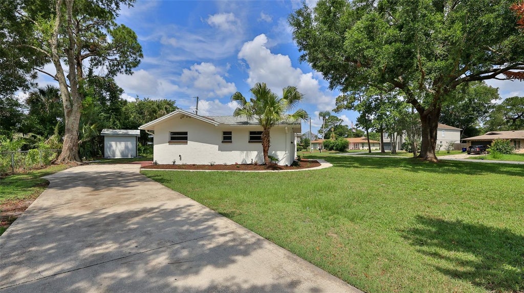 Photo of 2212 Woodland Drive, Edgewater, FL 32141 (MLS # NS1088427)