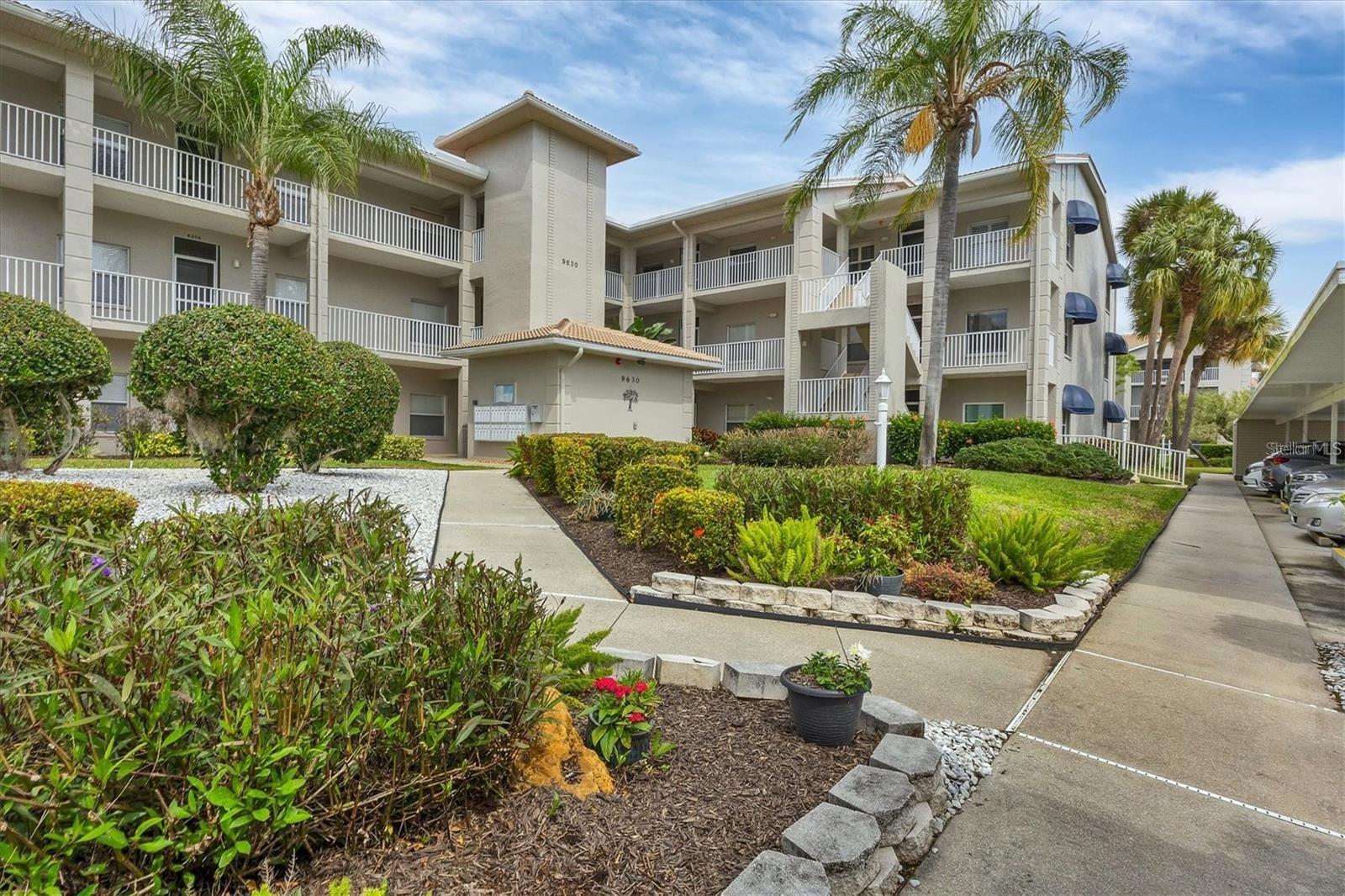 AVAILABLE JAN FEB MARCH & APRIL 2026 & OFFSEASON JUNE THROUGH DEC.2025. Second floor condo at Stoneybrook Club South (in elevator building) open floor plan, vinyl flooring in main living areas, granite counters and stainless steel appliances in the kitchen, dining area is open to the living area, large smart TV, and comfortable seating. The primary bedroom has king bed, a sliding glass door out onto the lanai, a walk-in closet, granite counter and walk-in shower. The second bedroom has double bed and twin bed making it perfect for those occasional guests. The glassed and screened lanai extends the living space and is a welcoming spot to relax and enjoy picturesque views across the lake and surroundings. The unit provides a convenient inside laundry, one covered parking space, a storage locker, and the community pool and tennis courts are right across the parking lot. The golf or social membership are available for transfer (check with clubhouse for fee schedule) allowing full use of all amenities, including access to the newly modernized golf course, a pristine pool, tennis courts, pickleball, and a clubhouse with a full-service restaurant and much more. The community borders the Legacy walking and biking trail, is less than 15 minutes from the sugary sandy beaches of Siesta Key, the village shops and restaurants, and a short drive to downtown Sarasota to enjoy the culinary and cultural experiences that Sarasota has to offer.