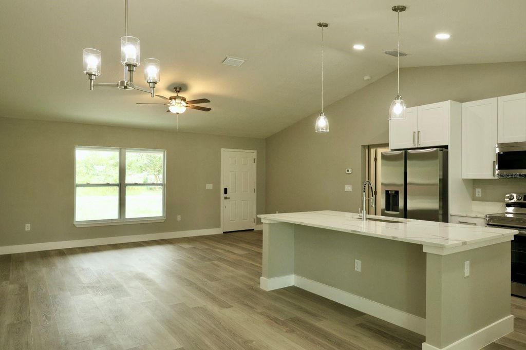 Photo of 138 Guava Pass Terrace, Ocklawaha, FL 32179 (MLS # O6352036)