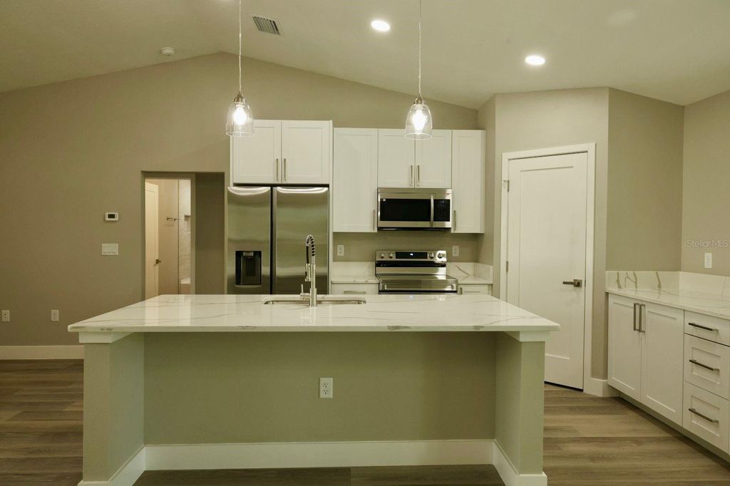 Photo of 138 Guava Pass Terrace, Ocklawaha, FL 32179 (MLS # O6352036)