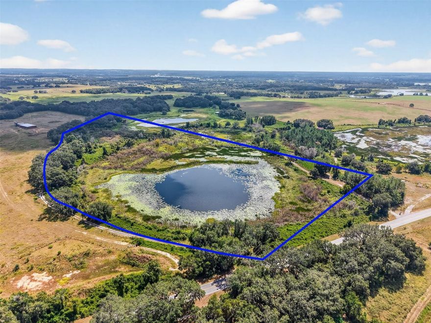 This exceptional 32+ acre property on Wilson's Marsh is a stunning piece of natural Florida landscape that offers the perfect site for your dream home. This secluded sanctuary offers incredible sunset views over your private lake and is an active haven for wildlife. The property is ideally situated just minutes from the Florida Turnpike, I-75, The Villages, Eastport Square, and a variety of retail and dining options. With frontage on County Road 48 utilities are easily accessible. This location ensures a private, nature-rich lifestyle without sacrificing convenience