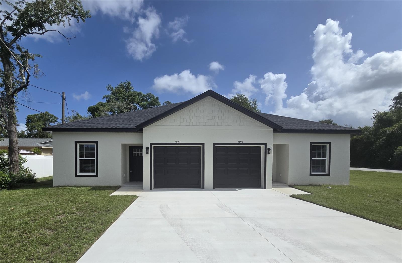 Built in 2025, this duplex is just what you have been looking for. Located in the heart of Spring Hill and close to shopping, dining and the expressway, this brand-new home has it all. Upon entering you walk into an open floor plan with a kitchen overlooking the living and dining room combo. The elegantly designed kitchen features soft close cabinets, stainless steel appliances and a pantry. The living room and master bedroom both have sliders leading to the covered lanai. The split floor plan offers privacy yet a sense of closeness. Do not miss this great home!