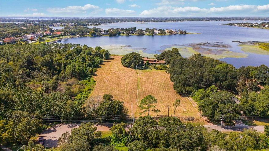 Exceptional DEVELOPMENT OPPORTUNITY,R-CE zoning may allow for 3 Lakefront Luxury Home Sites + Additional Lots on these two parcels.  Discover over 9 acres of waterfront land with 300 feet of pristine shoreline on LAKE DOWN, part of the coveted BUTLER CHAIN of Lakes. This is a rare chance to create a premier LAKEFRONT ESTATE or subdivide to create three ideally sized lots with 100 feet of water frontage — plus potential for additional non lakefront parcels.  At present, the property includes an older 5,000 sq ft home (5 bedrooms, 3.1 baths) and an oversized four car garage, which can serve as a temporary residence or teardown to make way for your vision. Why this property stands out, Unmatched location: Situated on the east side of Windermere, with convenient access from Conroy Windermere Road and Apopka Vineland.  Windermere prestige,  Offers the cachet of a WINDERMERE ADDRESS and proximity to luxury amenities.  Prime access: Minutes to Isleworth Country Club, Bay Hill, and downtown Windermere.  Development upside: Ready canvas for luxury estates in one of Central Florida’s most desirable waterfront corridors. Whether you’re a developer, custom builder, or investor, this is your opportunity explore and deliver truly exceptional homes in a highly sought-after market.