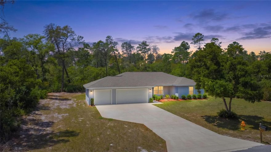 Tucked away on a full acre in the highly desirable Pine Ridge community, this 2022-built home with 1823 living area offers the space, flexibility, and lifestyle so many buyers are searching for. With 4 bedrooms, 2 bathrooms, and a 3-car garage, the layout is both functional and inviting, designed to accommodate everyday living while still feeling open and connected. The interior presents a well-designed open & split floor plan and luxury vinyl plank flooring & tile throughout the main areas. The kitchen is clean and timeless with white wood cabinetry, granite countertops, stainless steel appliances, and a breakfast bar that naturally connects to the dining area and living room—making it easy to stay engaged whether you’re hosting or enjoying a quiet evening at home. The primary suite features a walk-in closet and an ensuite bath complete with dual sinks and a walk-in shower. The additional bedrooms are versatile, ideal for guests, family, or a home office. The interior laundry room includes a washer and dryer for added convenience, and the sliding glass doors open to a screened lanai overlooking the backyard, with plenty of room to design your dream outdoor space. Set within one of Citrus County’s most sought-after deed-restricted equestrian communities, Pine Ridge is known for its appeal, minimal HOA fees, and unique amenities including riding trails, horse stables, a show arena, and boarding options. In addition, residents also enjoy access to a dog park, tennis and pickleball courts, and a community center. Conveniently located with easy access to the Suncoast Parkway, as well as nearby shopping, medical facilities, airports, and schools, this property offers the perfect blend of peaceful acreage living with everyday convenience.
