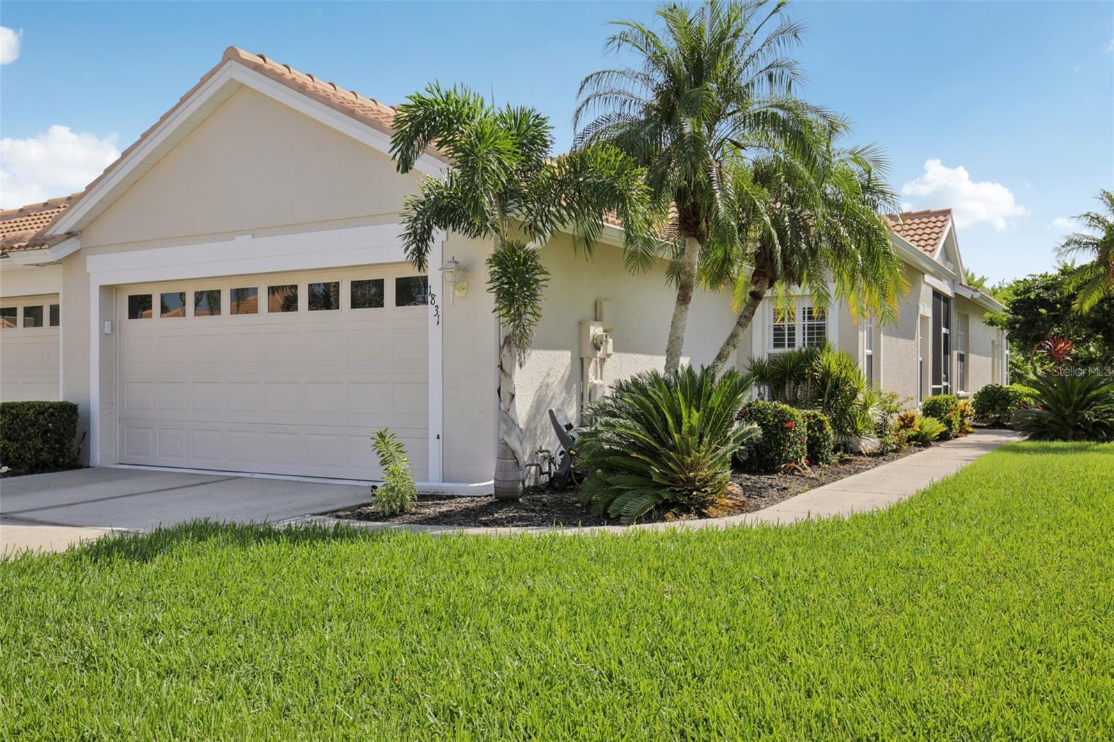 ** MOTIVATED SELLER, BRING YOUR OFFERS! **
End units sell fast in the award-winning golf community of Pelican Pointe, Venice FL! Meticulously maintained and lovingly cared for, this bright and sunny Birdie-model villa has windows on three sides overlooking the lush Florida landscaping and private preserve. Offering a desirable split bedroom layout, this 2-bedroom, 2-bathroom plus den/flex space villa has a large open-plan great room with hardwood floors, casual breakfast dining, screened sunroom and extended private patio - perfect for relaxing and entertaining. Located within a vibrant, 24/7 guard-gated community, residents enjoy access to 27-holes of championship golf consistently ranked the best in Venice since 2002. For the non-golfer, an impressive list of amenities includes a heated junior Olympic pool, tennis and pickleball courts, a clubhouse with restaurant, bar & grille, and a full social calendar with something for everyone—including a women’s association offering 45+ interest groups and activities. Pelican Pointe is a lively, welcoming community surrounded by natural lakes, wetlands, and abundant birdlife. Just minutes from quaint downtown Venice Island, pristine Gulf beaches, performing arts and cultural attractions, the Legacy Trail, top-rated medical facilities, and major airports. Recent upgrades include: new tile roof (2023), new water heater (2022), A/C (2019), stainless steel appliances, and fresh exterior and interior paint. The low HOA fee covers membership to the social club, cable, internet, lawn and landscape care, exterior maintenance, pest control, and more—offering true peace of mind and lock-and-leave convenience. Golf course membership is non-mandatory. Don't miss this exceptional opportunity to live the Florida lifestyle at its finest!