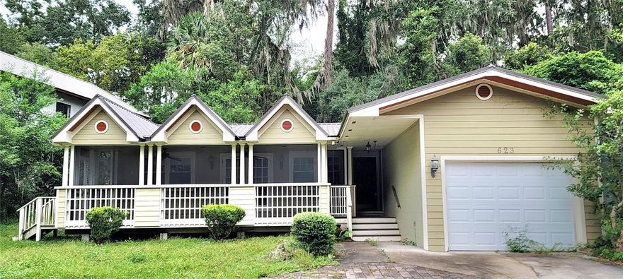 Walk or ride your bike to the UF Law School or campus from this 3 Bedroom/2 Bathroom home in desirable Golfview Estates overlooking the Mark Bostic Golf Course. A large screened-in porch welcomes you to the house and is perfect for year-round use and enjoying the sounds of nature. This home has Engineered Hardwood floors in the Public Rooms and Bedrooms. No carpet! A 24-gauge Metal Roof was installed in 2018 along with a Tankless Water Heater in 2013. A large indoor Laundry Room is next to the single-car Garage. A paver patio in the backyard offers a quiet place to relax amongst the trees. Close to shopping, the UF Bat Houses and Lake Alice. Grab your golf clubs and come have a look! Professional photos coming soon.
