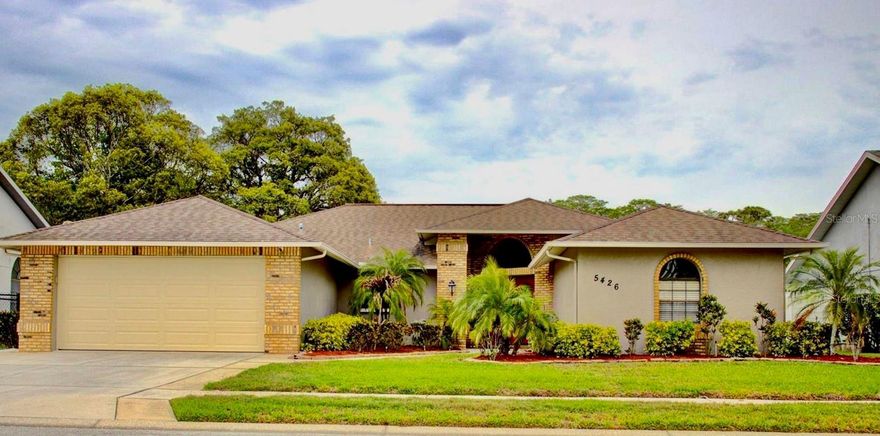 Price just lowered for a fast sale !! Welcome to this beautiful 3 bedroom 2 bath with an amazing waterfront view where you can sit and enjoy nature's beauty and tranquility with no backyard neighbors. This  Property comes with a screened in pool (pump that is only 1.5 year old), a very large Florida room, beautiful granite kitchen countertops, stainless steel Samsung appliances all 3 years old; Fridge with WiFi Portal, 5 year old A/C Unit still under part warranty for 5 more years service by Air Hawk AC Service. An amazing wet bar in living room, a Dog run Fence (166 feet); perfect for dog lovers. 4 New storm Windows in the back side of the house, water softener installed by Culligan water Co. New vinyl privacy fence , two car garage with new hurricane rated doors, "like new" Samsung washer & dryer, new ceiling fans, new rigid vinyl plank wood flooring installed in family room. Close to Starkey Wilderness Park and access to Starkey Road makes shopping, schools and restaurants easily accessible. This home has been very well taken care of and maintained. A huge bathroom connects the master suite. Plenty of closet space including walk-in. Functional and yet fancy very well laid out floor plan. The Roof was inspected 3 months ago for Homeowners Insurance Renewal that passed inspection. Inspection revealed that roof has another 8-10 years life. LOW ANNUAL HOA FEE !! Sold as is.
 MOVE IN READY !!!Seller pays for Title and selects Cloud title