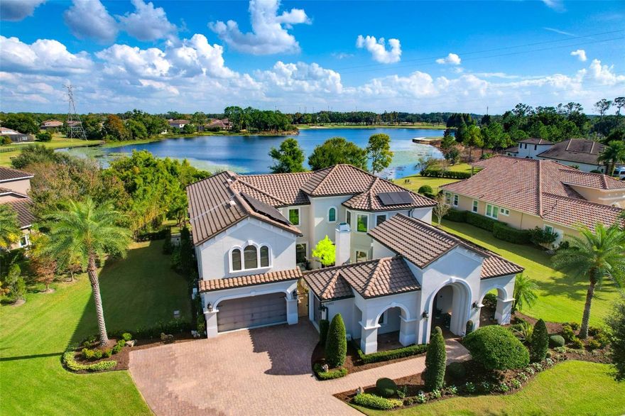 Discover elevated luxury living in the heart of the gated community of Old Memorial Estates. This exquisitely crafted residence showcases custom millwork throughout the home. Enjoy cozy time with family in the conservatory or a grand affair in the great room just to the other side with vaulted ceilings, grand windows with views to Hixon Lake and distant views of Old Memorial Golf Course. The primary suite is on the first level with the most amazing primary bath. Recently updated you will feel like you are in a Five Star Hotel. Guests visiting for an extended time can come and go as they please with the ensuite guest bedroom with access from outside. The second level offers 3 bedrooms. 2 with ensuite baths, the game room and the theater room waiting for its customization. As the interior of the home will take your breath away the outdoors will provide you with a resort-style experience with the custom pool with fire features and waterfall features. Feel like you are cave diving with the grotto feature in the pool. Enjoy the outdoors bug free with the mosquito system in place for those cozy fall nights outside by the firepit. This is more than a home it's a lifestyle of uncompromising excellence, just minutes from shopping, restaurants, Tampa International Airport and the local beaches.