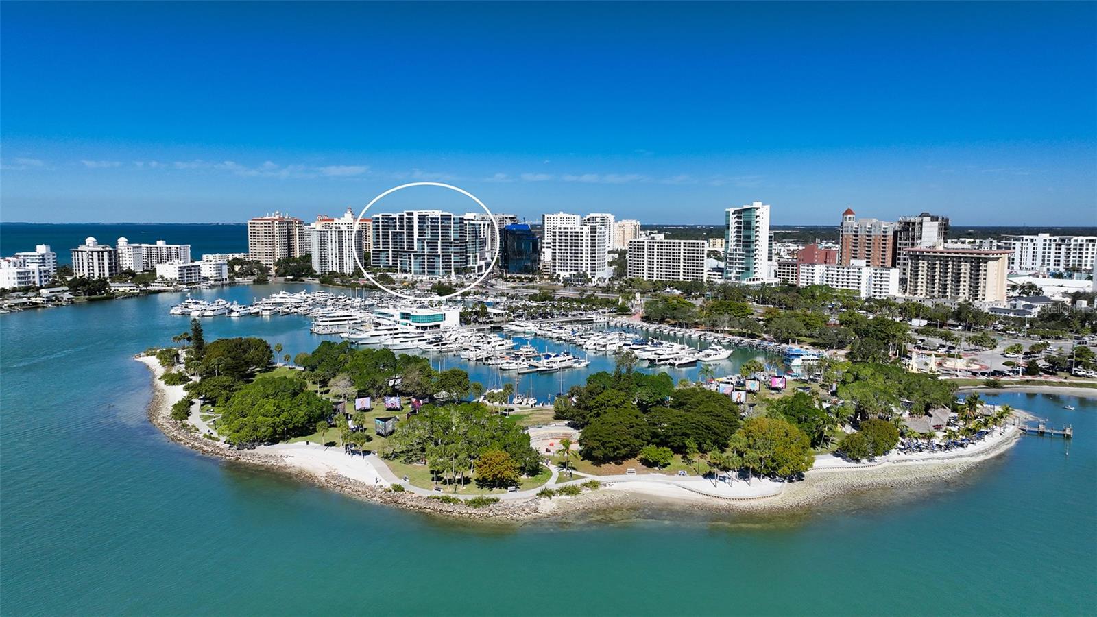 Elevated living at The Vue, one of Sarasota's premier downtown condominiums. This elegant 11th-floor residence offers breathtaking, unobstructed views of Sarasota Bay, the marina, and through Big Pass to the Gulf of Mexico. The coveted 06 stack is a floor plan featuring a dedicated office/den and a fully private, south-facing balcony that is shaded all day and ideal for enjoying vivid sunsets and bay breezes. Ten-foot floor-to-ceiling windows in the living room and primary bedroom bring in abundant light and stunning water views. The sleek, open layout is complemented by high-end finishes and a gourmet kitchen with premium appliances, designer cabinetry, and a spacious island for entertaining. The Vue offers resort-style amenities including 24/7 concierge, heated pool and spa, rooftop dog park, fitness center, club lounge, board room, and elegant spaces to host guests. Residents also enjoy a complimentary city shuttle to Lido Beach and downtown's Main Street. Ideally located in the heart of Sarasota, you're just steps from fine dining, art galleries, live music, the performing arts, and waterfront parks. Sophisticated design, luxury amenities, and unmatched views. This is downtown living at its finest.