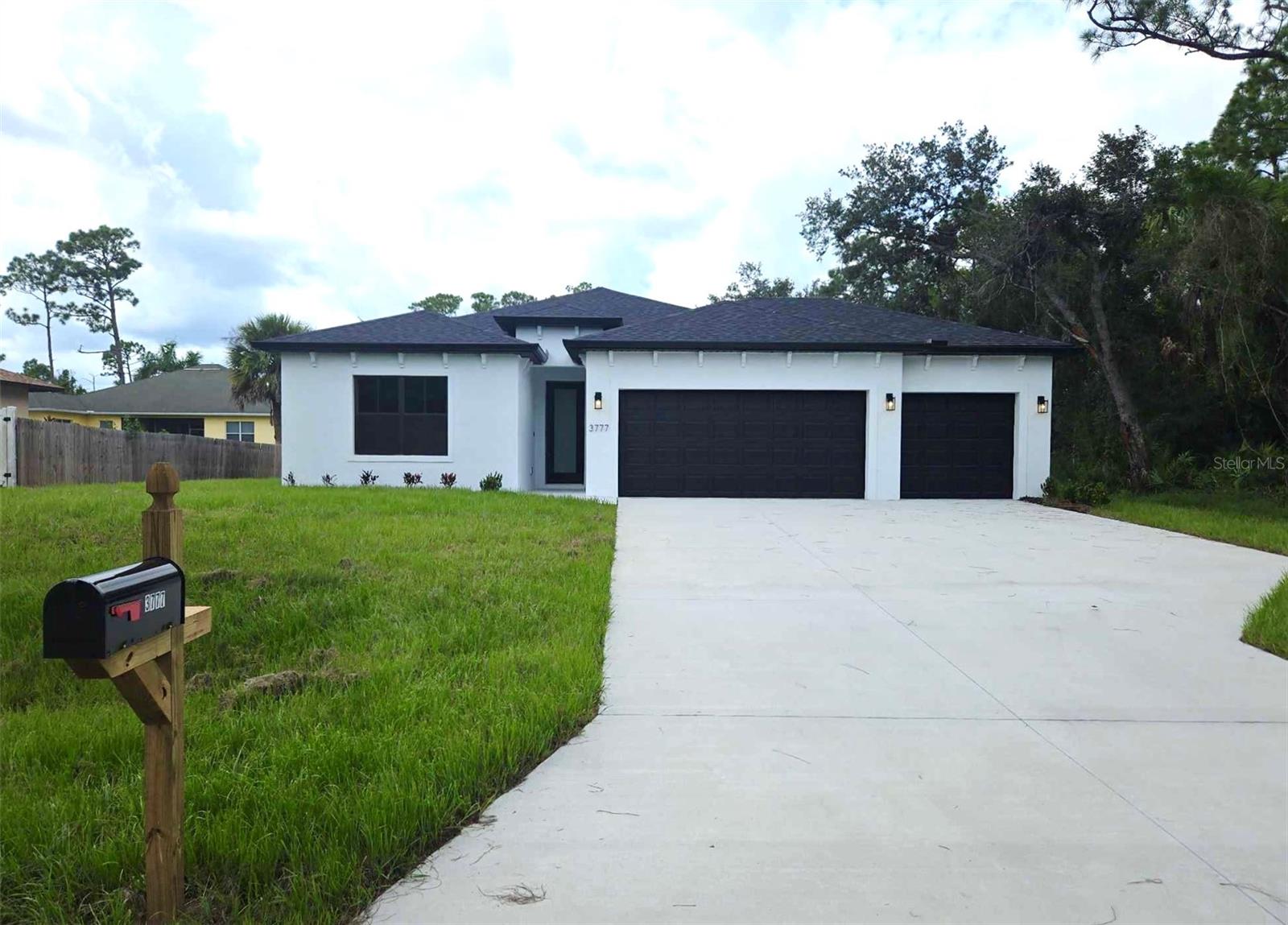 Welcome to your dream home! This stunning brand-new construction in North Port, Florida, is fully completed and move-in ready, offering modern elegance, high-end finishes, and exceptional craftsmanship in a peaceful yet thriving community. This spacious four-bedroom, three-bathroom home with a three-car garage features an open floor plan with soaring ceilings and an abundance of natural light. Luxury vinyl plank flooring flows throughout, providing a stylish and durable foundation.
The gourmet kitchen is designed for both function and beauty, featuring quartz countertops, stainless steel appliances, a large center island, soft-close cabinetry, and a walk-in pantry. The primary suite is a true retreat, offering his-and-hers walk-in closets and a spa-like ensuite with dual vanities and a glass-enclosed walk-in shower. A second bedroom also includes a private ensuite, making it perfect for guests or multigenerational living. The remaining two bedrooms offer flexibility for family, a home office, or hobby space.
Sliding glass doors lead to a covered and screened-in lanai, an ideal space to unwind and enjoy Florida’s year-round sunshine. The backyard provides privacy and ample room for outdoor activities or future enhancements. For added peace of mind, this home comes with a seven-year structural warranty, a one-year workmanship warranty, and a one-year distribution systems warranty.
North Port is one of Florida’s fastest-growing cities, offering a perfect balance of natural beauty, outdoor recreation, and modern amenities. This home is just a short drive from world-famous Gulf Coast beaches such as Siesta Key, Venice Beach, and Manasota Key. Outdoor enthusiasts will love the miles of scenic trails, parks, golf courses, and waterways for boating, fishing, and kayaking. The city is also home to top-rated schools, shopping centers, dining, entertainment, and cultural experiences. With easy access to I-75, commuting to Sarasota, Fort Myers, and beyond is a breeze.
With North Port’s rapid growth and rising home values, this is an excellent opportunity for homeowners and investors alike. Work with our preferred lender for low wholesale rates, reduced cash-to-close, and potential first-time buyer grants—plus up to $1,500.00 in lender credits for rate buydowns. Don’t miss out on this incredible home—schedule your private showing today!