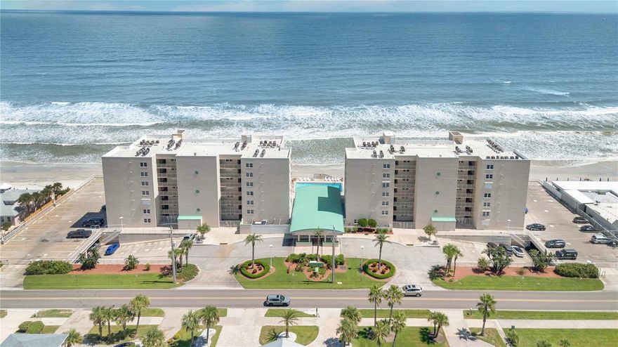 Wake up to the sights and sounds of the Atlantic Ocean in this beautifully updated 2 bed, 2 bath oceanfront condo in sought-after Ponce Inlet. With 1,200 sq ft of fully upgraded coastal charm, enjoy features like the bright and open kitchen that stuns with quartz countertops, all new appliances, built-in fridge and wine cooler, tile backsplash and shiplap at the island. Both bathrooms boast custom tile work, glass shower enclosures and modern vanities. Step out onto the private balcony and enjoy sunrises over the ocean in the mornings as well as sunsets over the river in the evenings. Unwind in the heated beachfront pool or head down to enjoy the fabulous beach front! Back inside you'll notice more upgrades such as brand new LVP Flooring throughout, custom electric blinds, crown molding, baseboards, electric hurricane shutters, furred ceilings with recessed lighting so you don't see any unsightly wires or chase coverings and a tankless hot water heater that saves you space and won't leak. Other amenities include covered parking, a large community room with kitchen, and newly surfaced tennis/pickleball courts. Discover a true Florida beach town with a rich history and loads of nature parks, water activities and waterfront restaurants to relax and unwind. You also get peace of mind because all engineering requirements have been met in this turnkey, low-maintenance, beach-ready Condo!